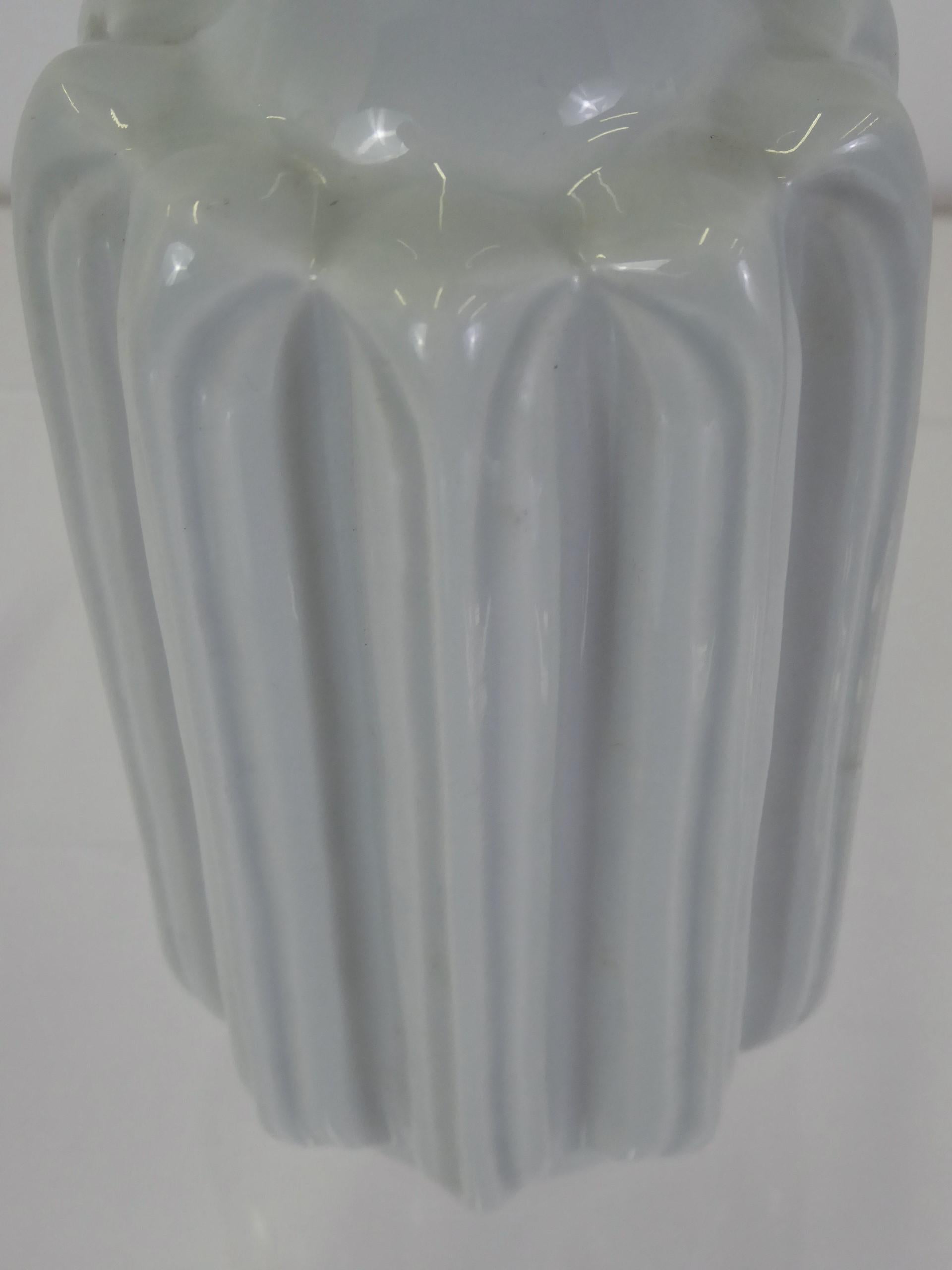 Hand-thrown celadon colored ceramic vase by Lisbeth Munch-Petersen (1909-1997) for B & G Copenhagen from 1960s.

Munch-Petersen followed her father’s profession, Danish ceramist Hans Adolph Hjort (1878-1966), to also become a potter. Lisbeth along