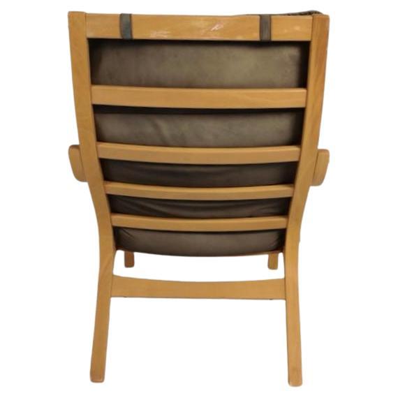 Scandinavian Modern Danish Modern lounge chair and ottoman in bent beech wood and brown leather