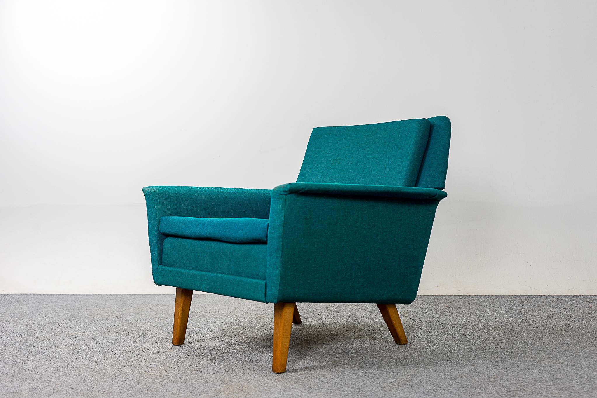 Beech wood Danish lounge chair by Fritz Hansen, circa 1960's. Elegant lounge chair with clean modern lines and contrasting solid beech legs. Original teal fabric shows wear & tear. Fritz Hansen makers mark intact!

Please inquire for international