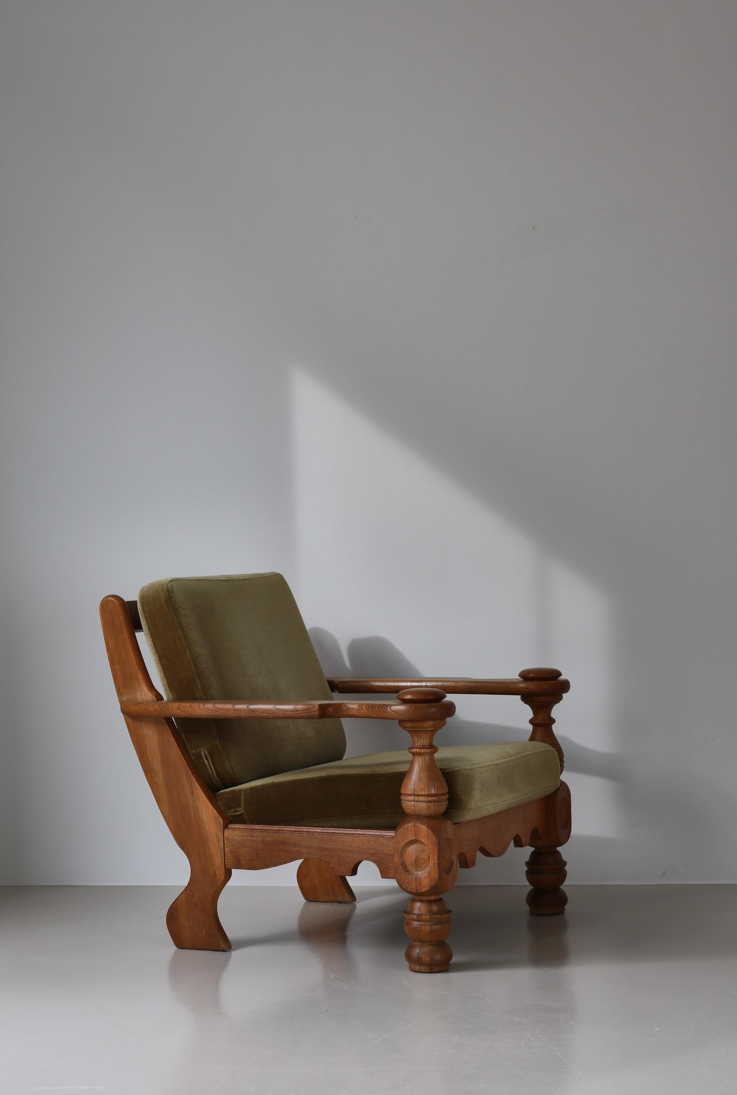Very charming and rustic large easy chair designed by Henry Kjærnulf and manufactured in the 1950s. The chair is made of solid oak and the loose cushions are upholstered in green mohair. Great seating comfort.
Danish midcentury designer and