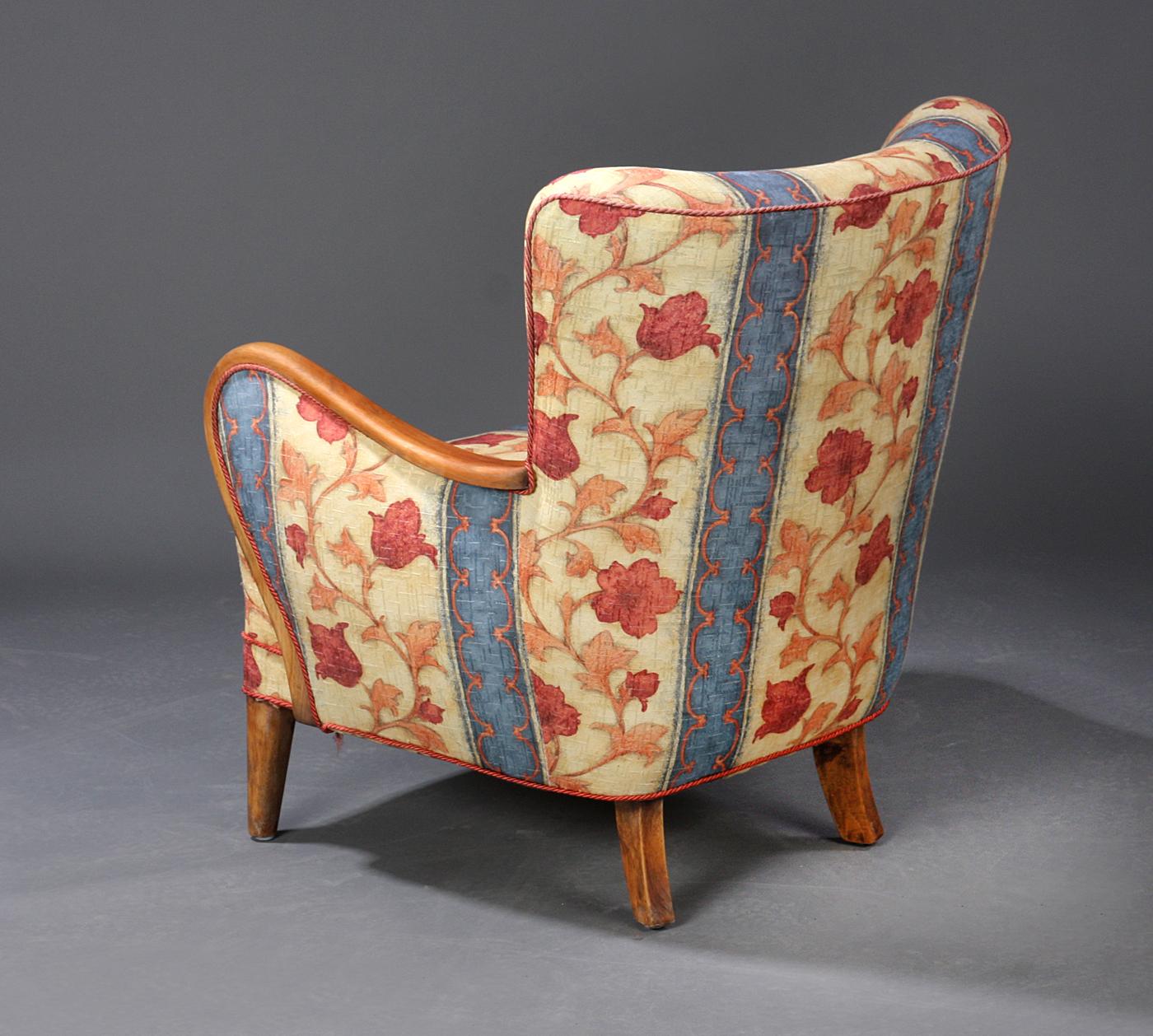 Danish furniture manufacturer, fine upholstered lounge chair with bentwood arms and later floral upholstery, beech frame, 1940-1950.