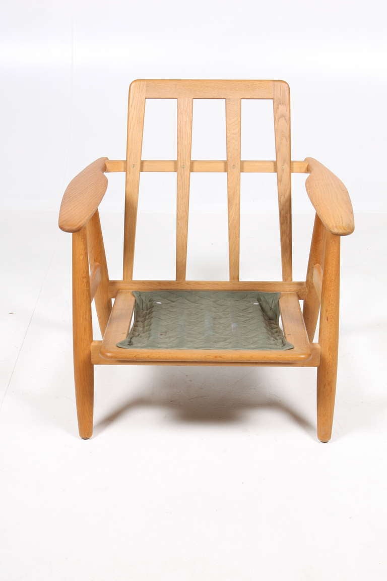 Scandinavian Modern Danish Modern Lounge Chair in Patinated Oak by Hans Wegner by GETAMA, 1950