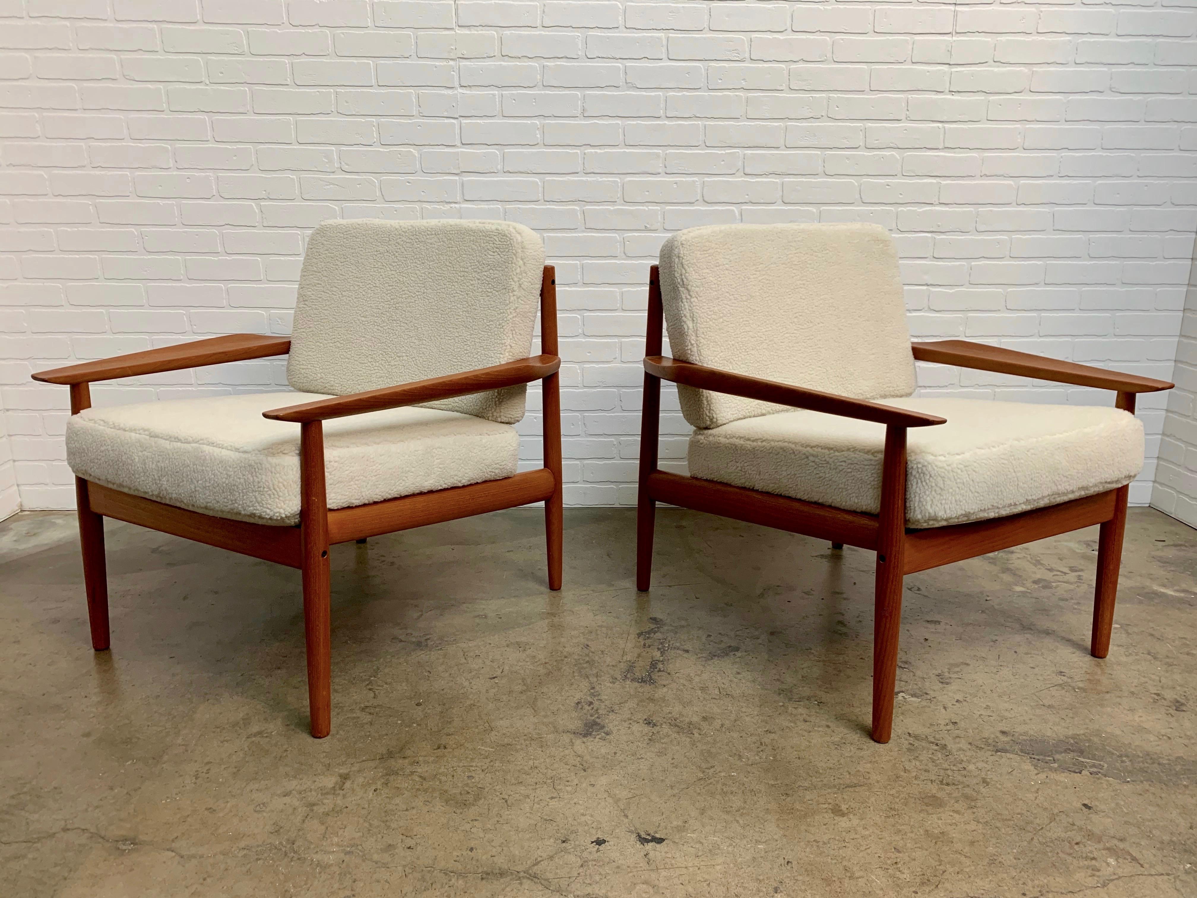 Solid teak armchairs with new Sherpa faux fur designed by Arne Vodder.