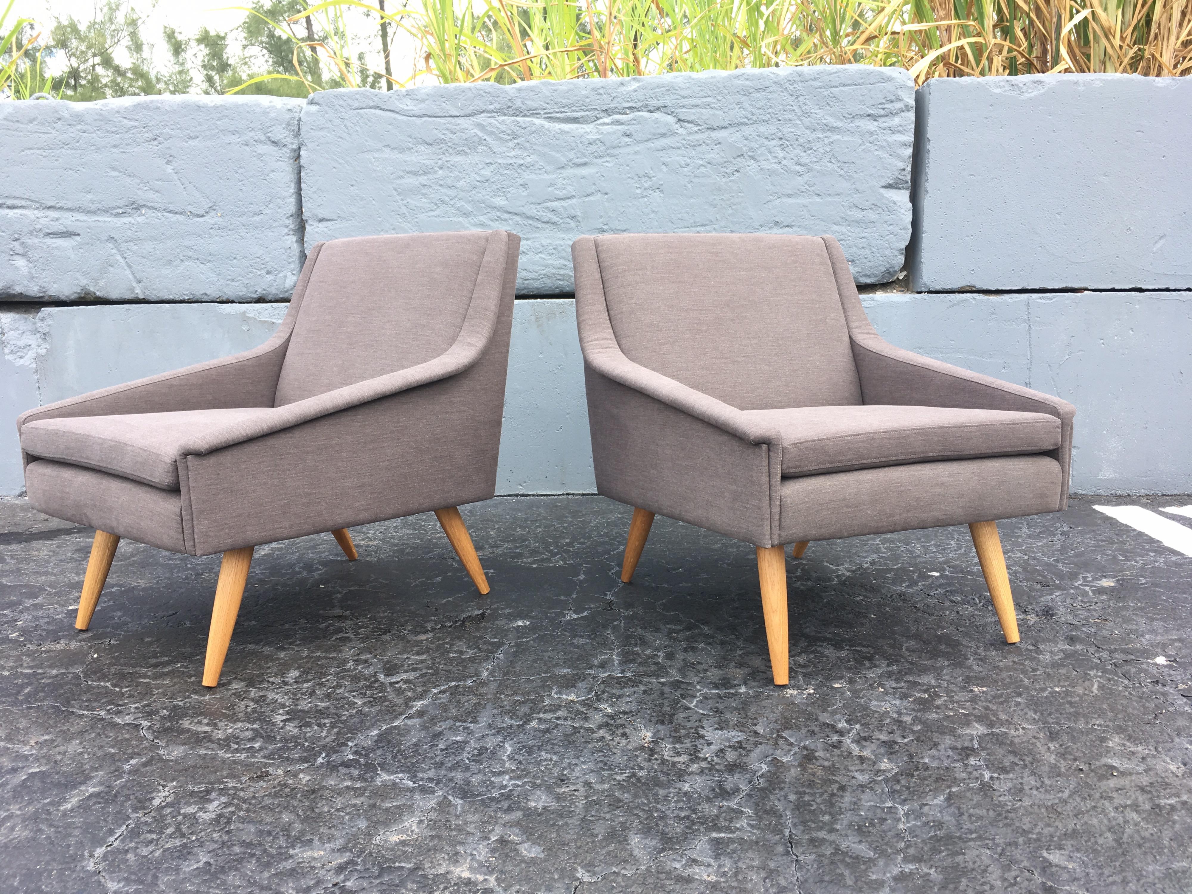 Great pair of Danish modern lounge chairs, gray fabric and oak legs. Ready for a new home.