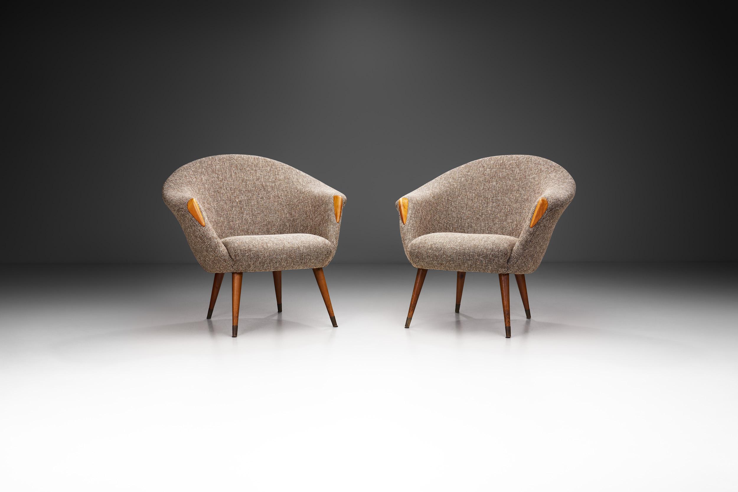 These chairs have a soft design edge that is immediately recognizable. These chairs have unmistakeable shell bodies where the back cascades down to form the armrests. While the armrests sit low and curve outwards, therefore opening the seats, the