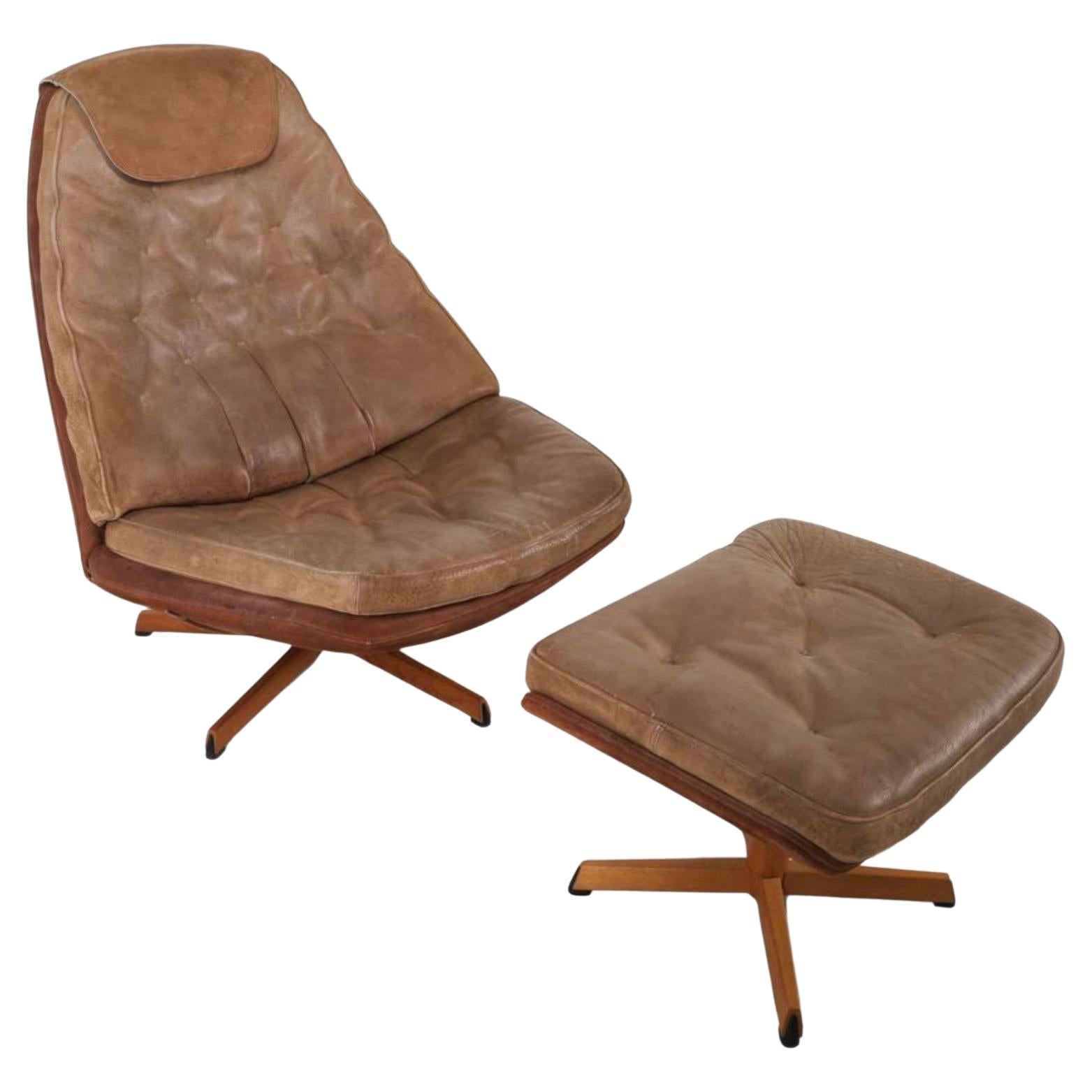 Danish modern Madsen & Schubell tan Leather Swivel Lounge chair with ottoman. Great Scandinavian designed chair and ottoman with tan leather cushions and suede backing with Oak cladding. Shows normal wear from age and use - very comfortable chair.
