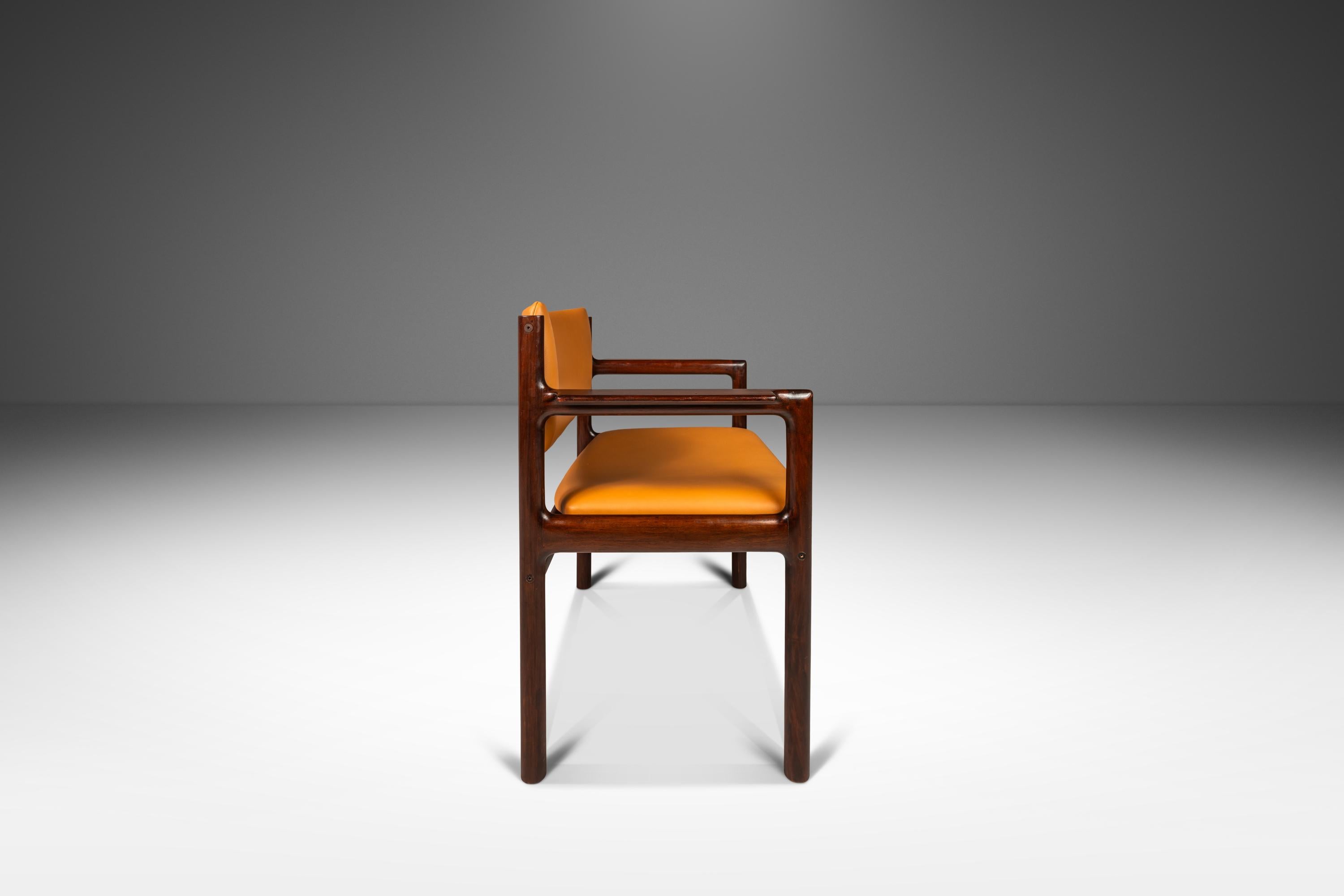 Introducing a rare Danish-designed arm chair constructed from solid mahogany and featuring new Italian leather upholstery. Simultaneously elegant and minimal this extraordinary chair is a designer's dream.

The mahogany frame, in 100% original