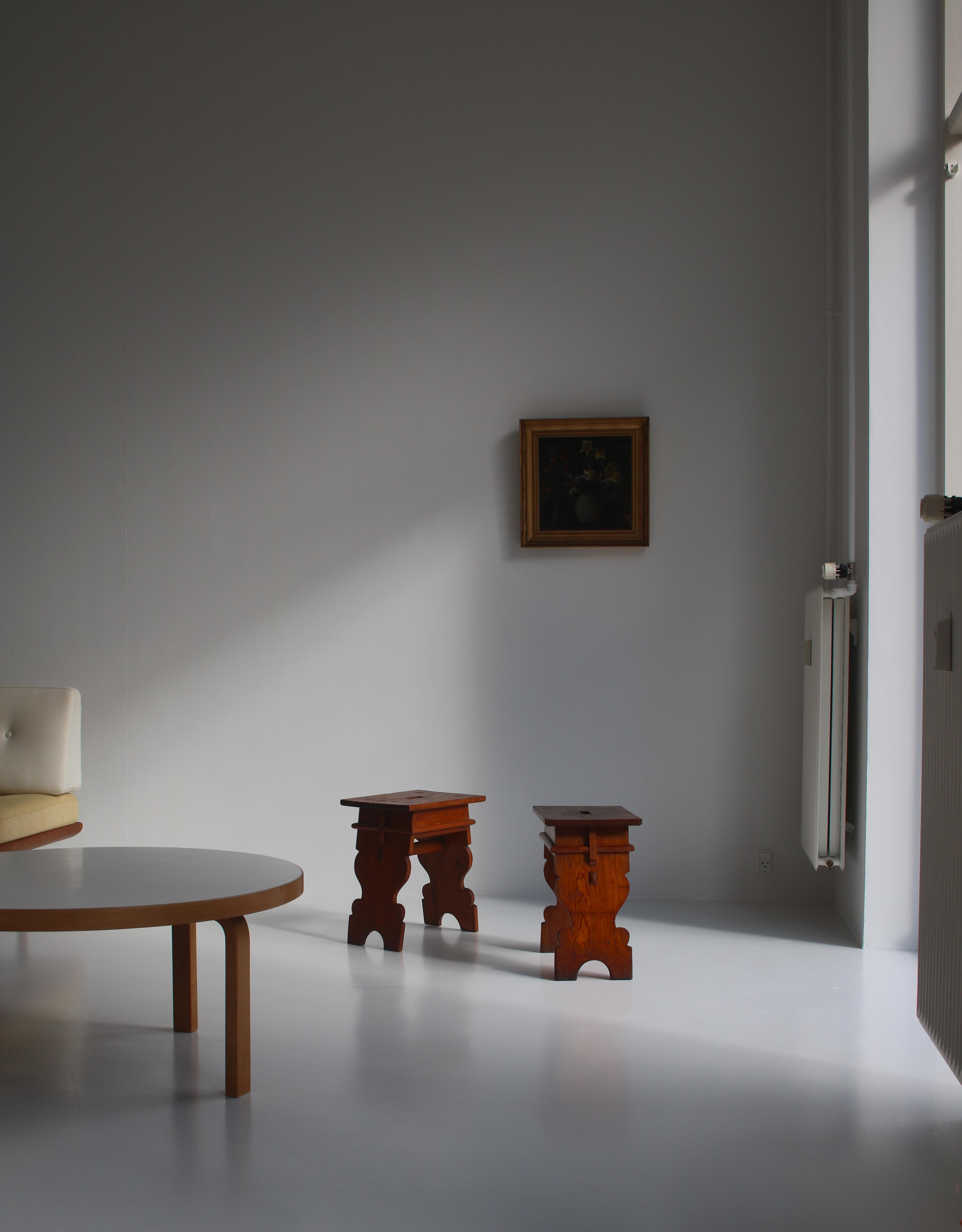 Rare and important set of stools in Oregon pine made at cabinetmaker Rud Rasmussen. The stools was made as part of the interior for Copenhagen Town Hall in 1905 which was also designed by architect Martin Nyrop. The stools are in good original