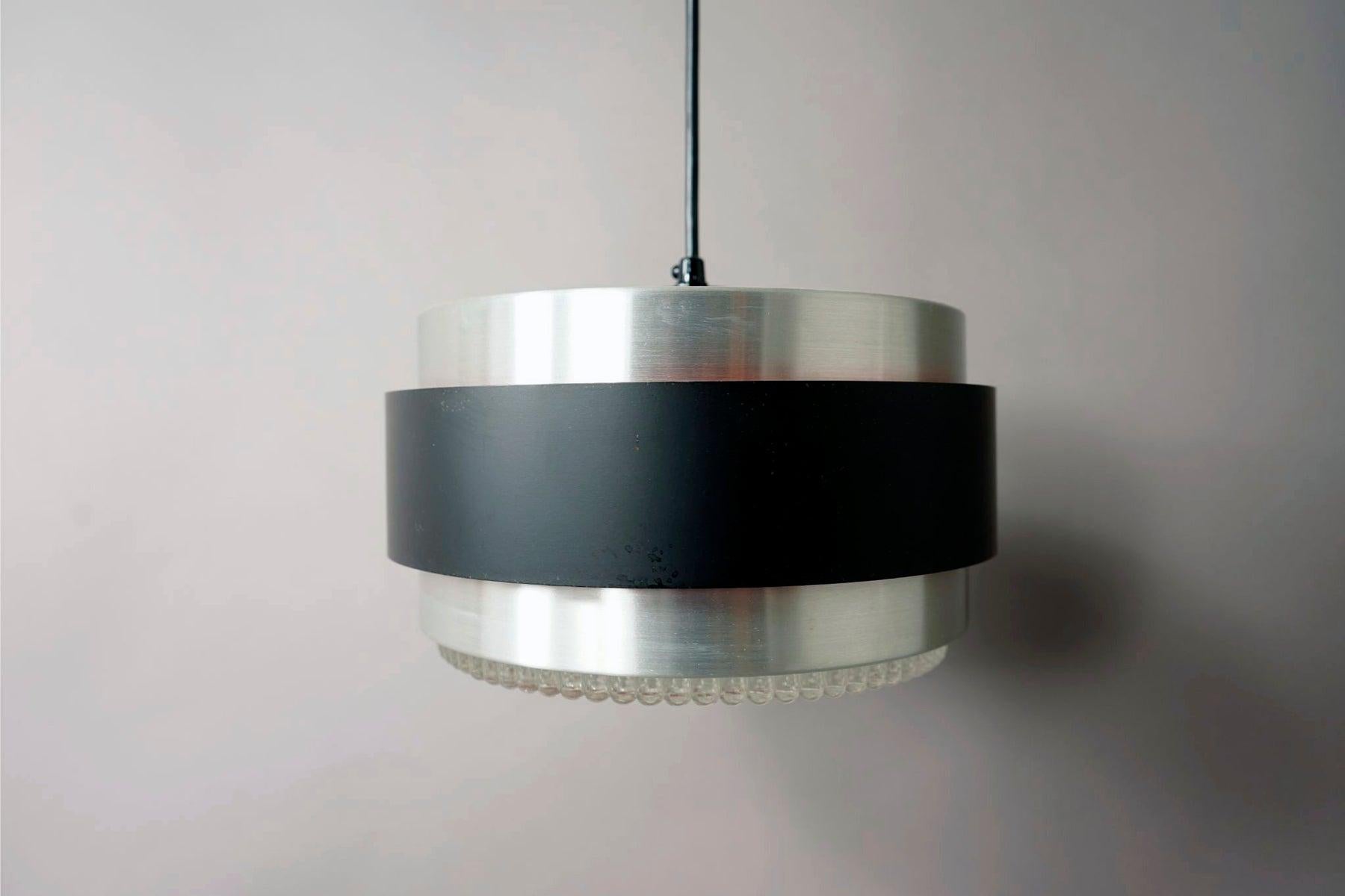 Metal and glass Danish modern pendant light, circa 1960's. This light features metal shade with original solid cast glass diffuser. Attributed to Jo Hammerborg, this appears to be the Saturn model. Made by Fog & Morup

This light has been re-wired
