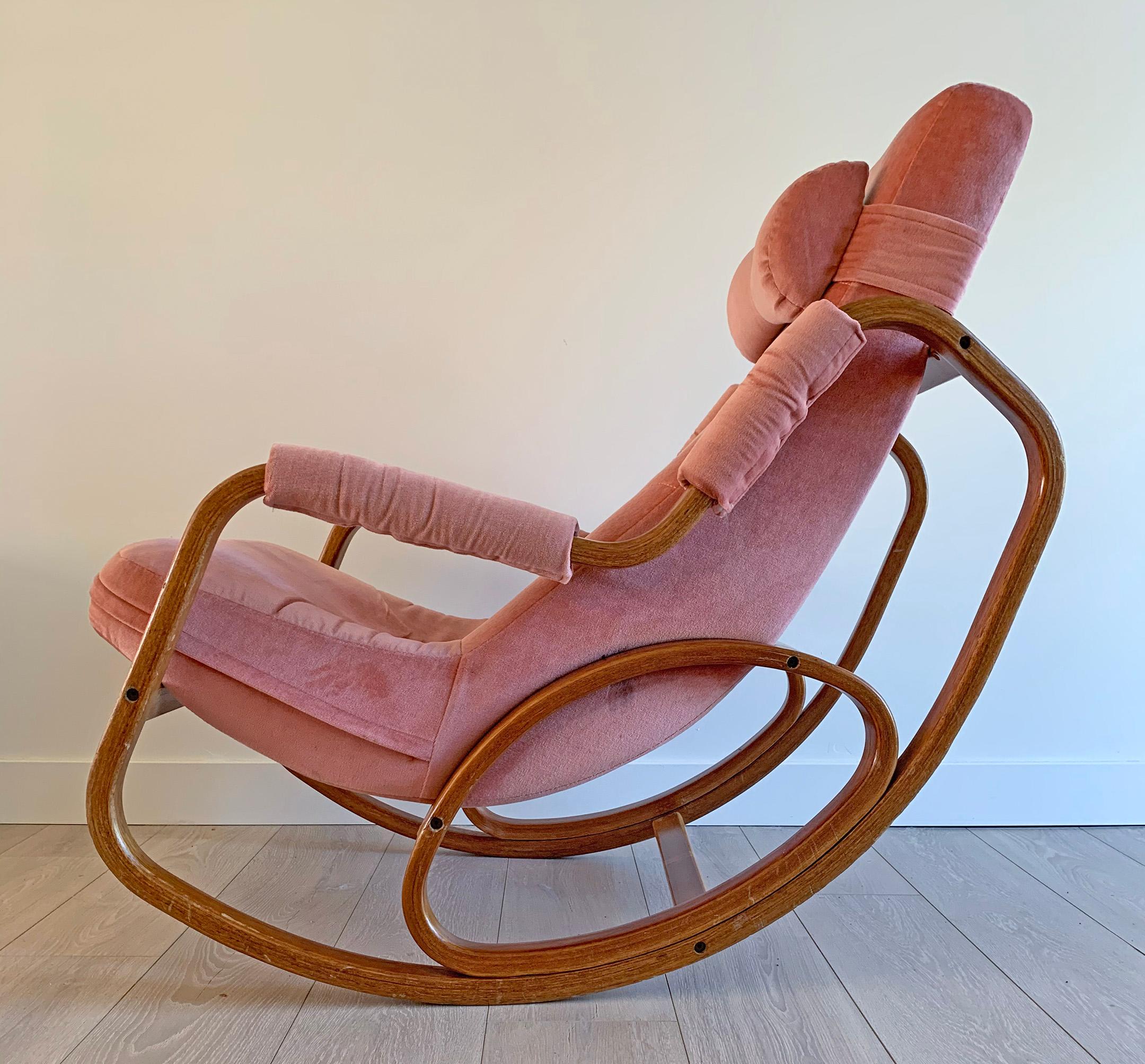 This rocking chair is absolutely stunning! With whimsical round lines and bentwood, this Danish modern lounge chair / rocking chair is a must have. Many people associate bent-wood with Thonet or Josef Hoffmann, and while we have seen a couple other