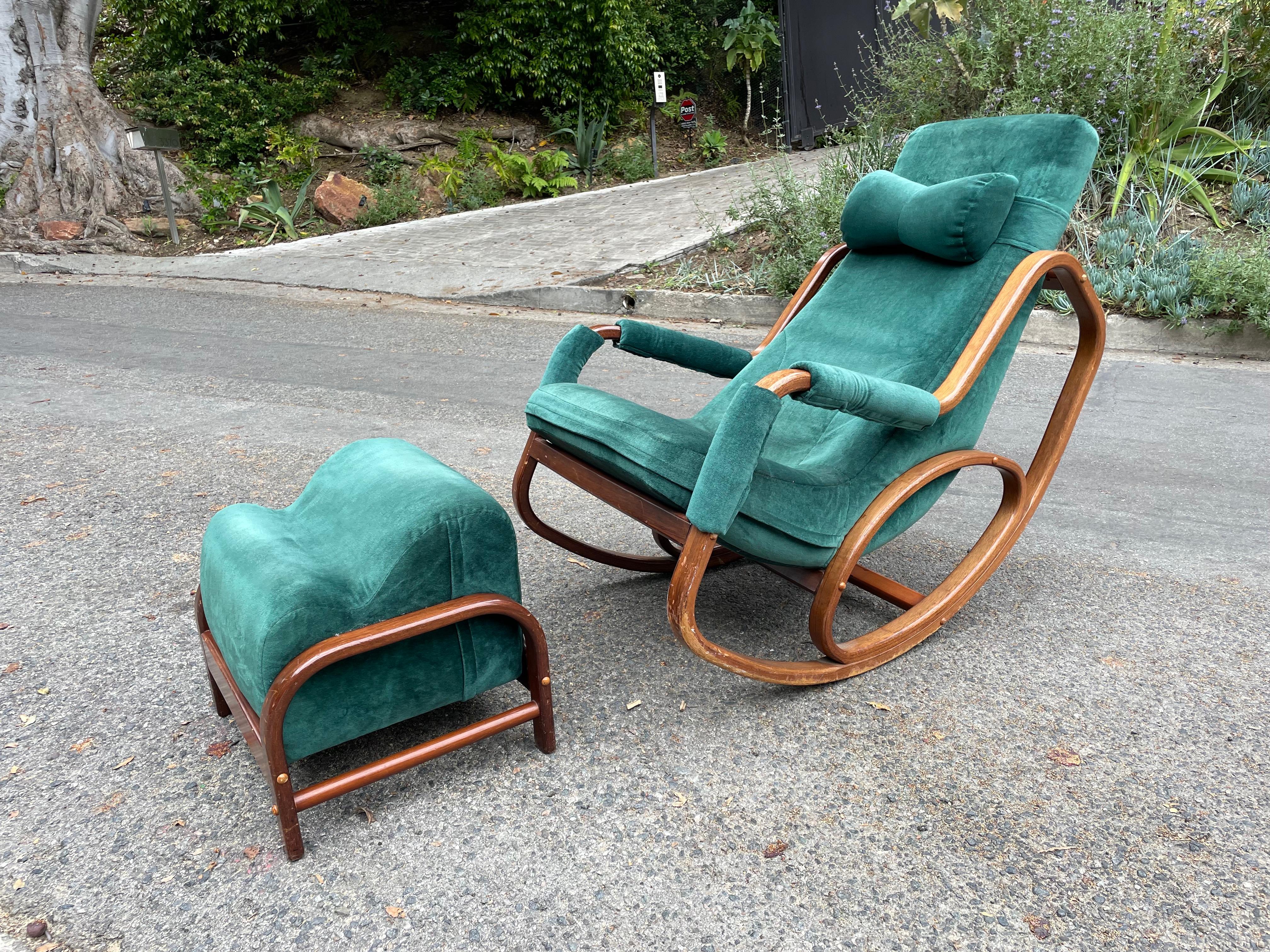 Stunning Danish Modern rocking chair with round lines and bentwood. In the manner of Thonet, Josef Hoffman, Tendo Mokko and Kofod Larsen.

The chair features its original bow-tie shaped head rest and is upholstered in a rich green velvet. The rare