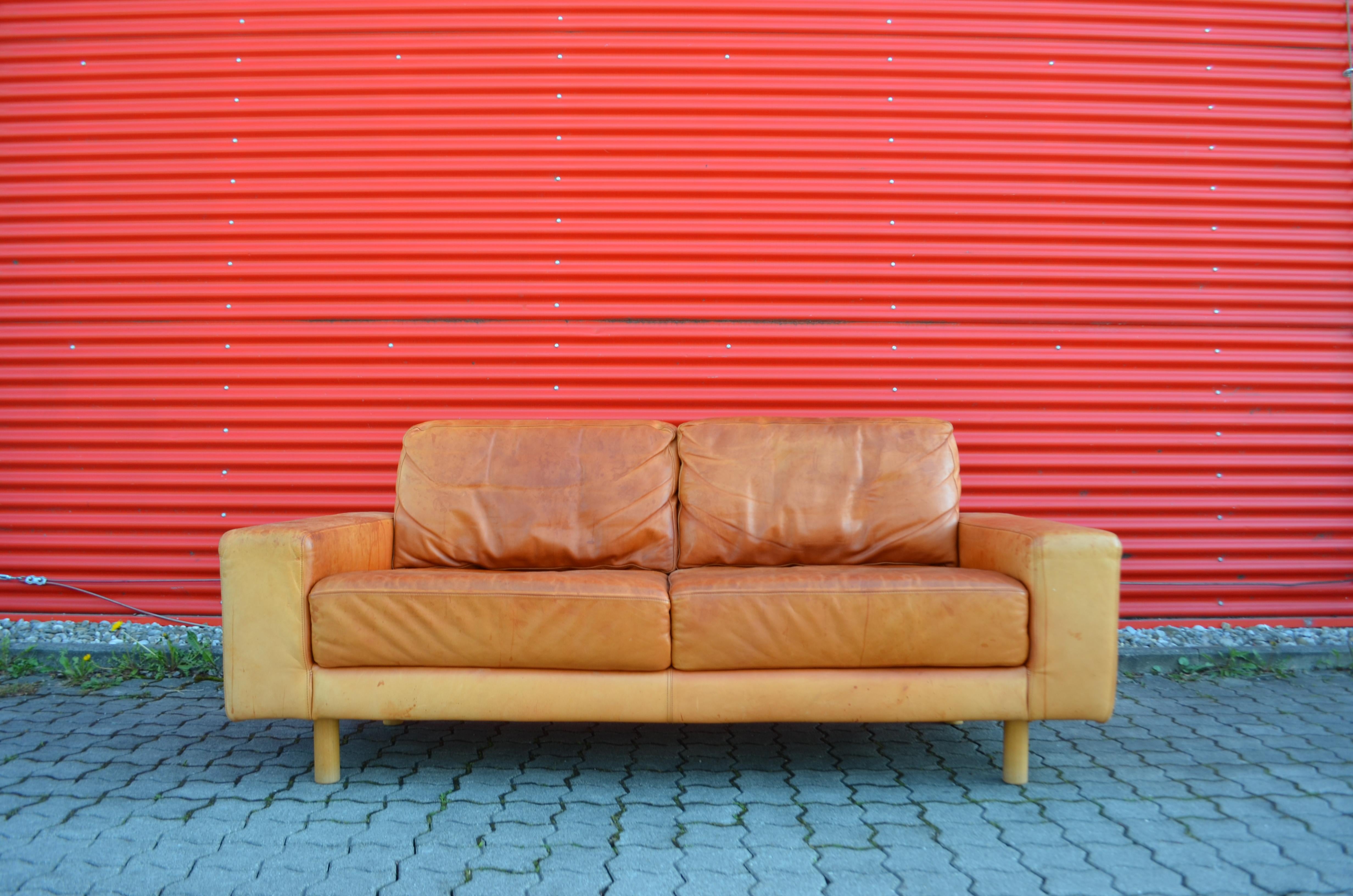 Gorgeous vintage Danish modern leather sofa.
The cognac leather has a rich stunning patina with lot signs of use during the age.
The leather looks like vegetal leather but it is a fine aniline leather with a great touch.
Some little cat scratches on