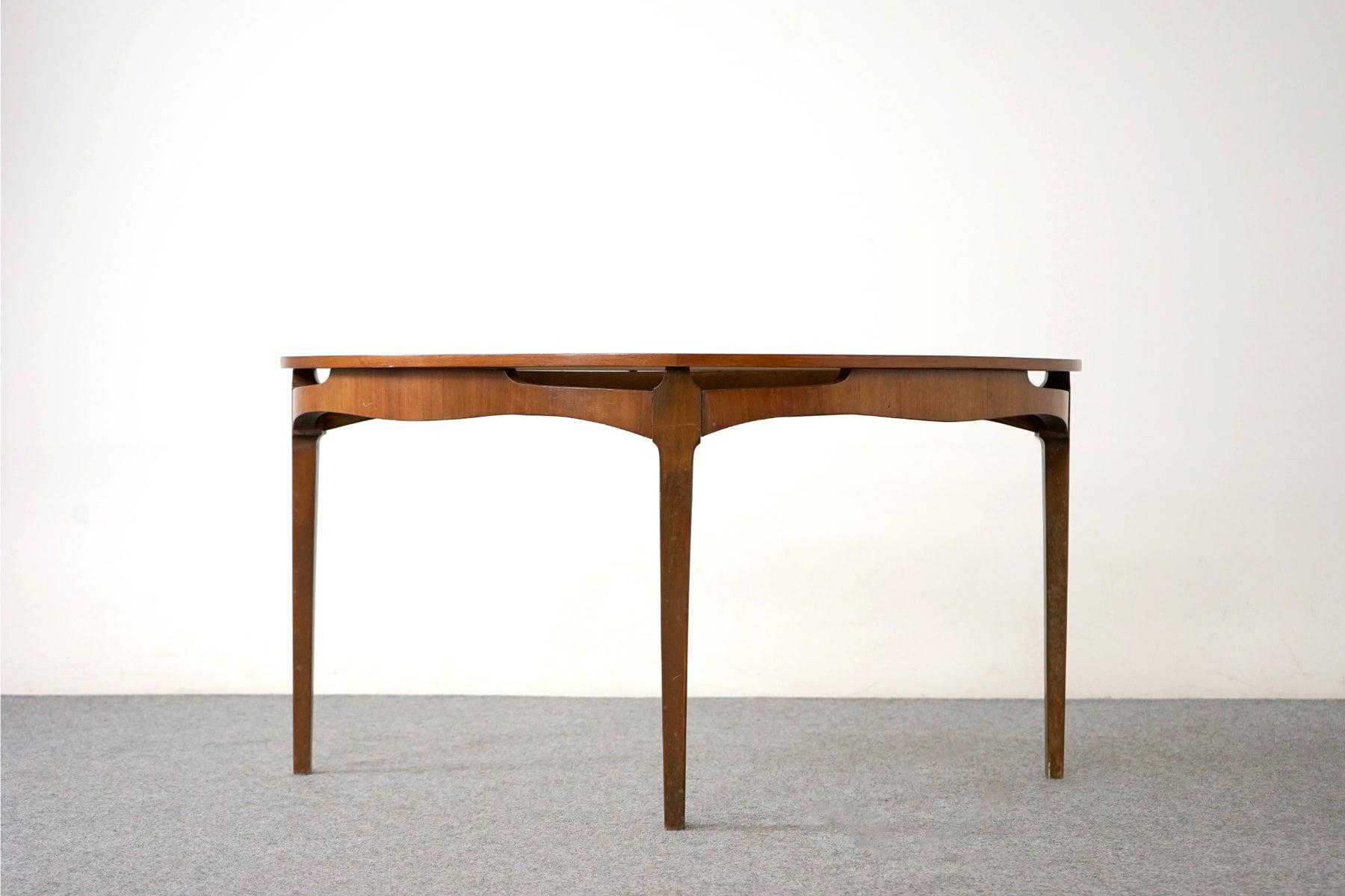 Walnut side table, circa 1950's. Unique floating top, beautifully sculpted edges and stunning grain patterns. Add some Danish style with this unique table.

Unrestored item, some marks consistent with age.
 