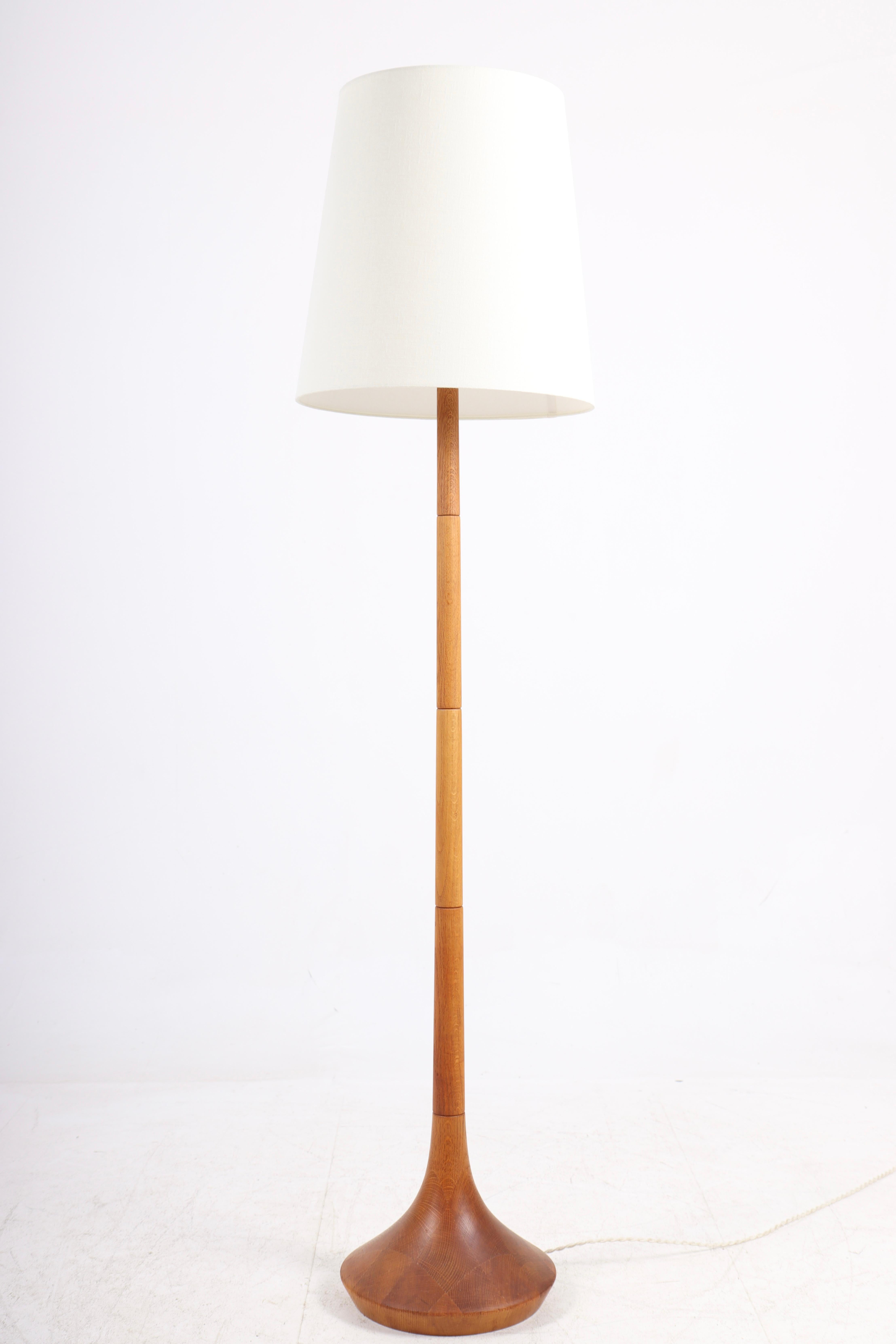 Great looking floor lamp in oak and fabric shade. Designed and made in Denmark.