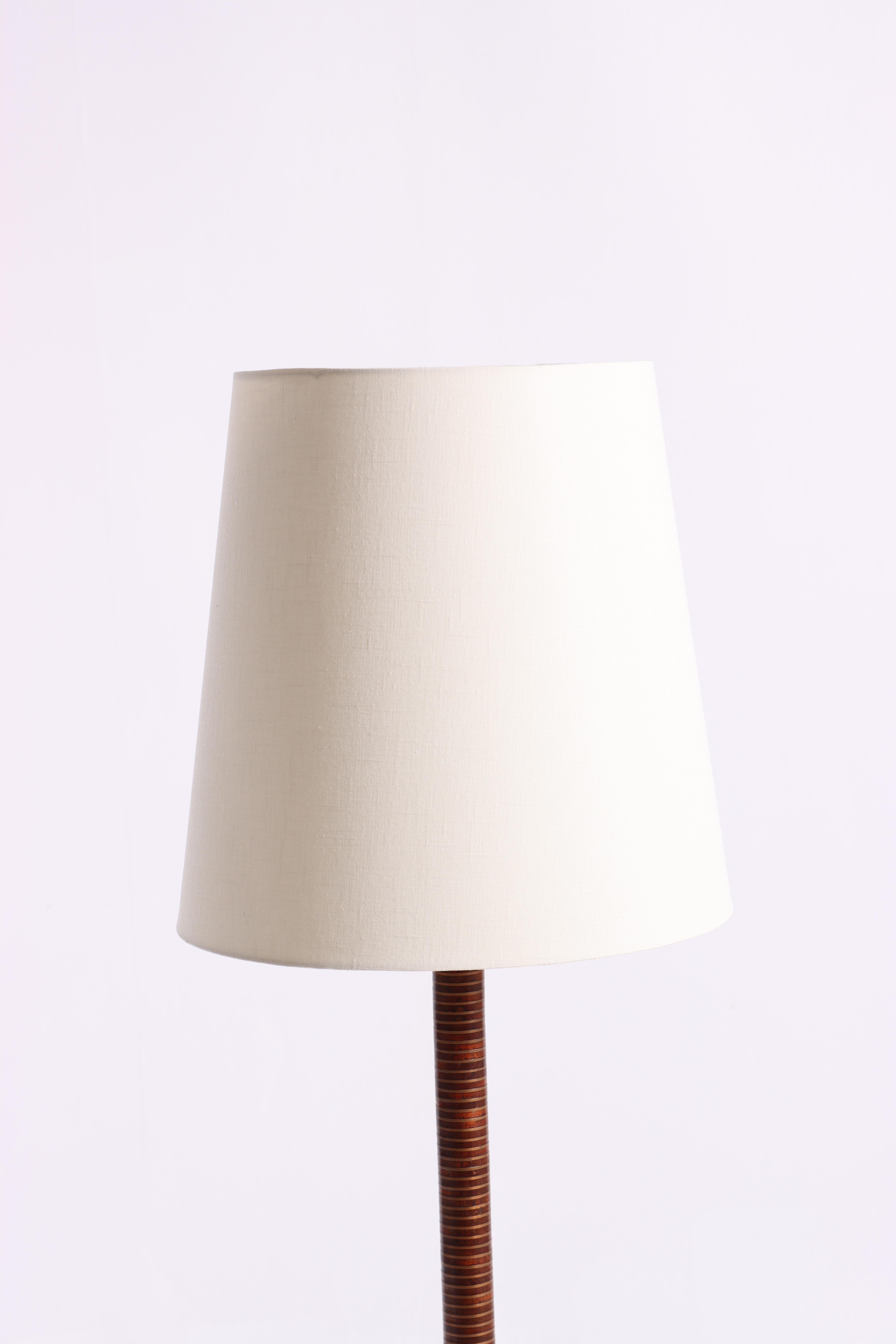 Rare floor lamp in teak and copper with new fabric shade. Designed and made in Denmark.