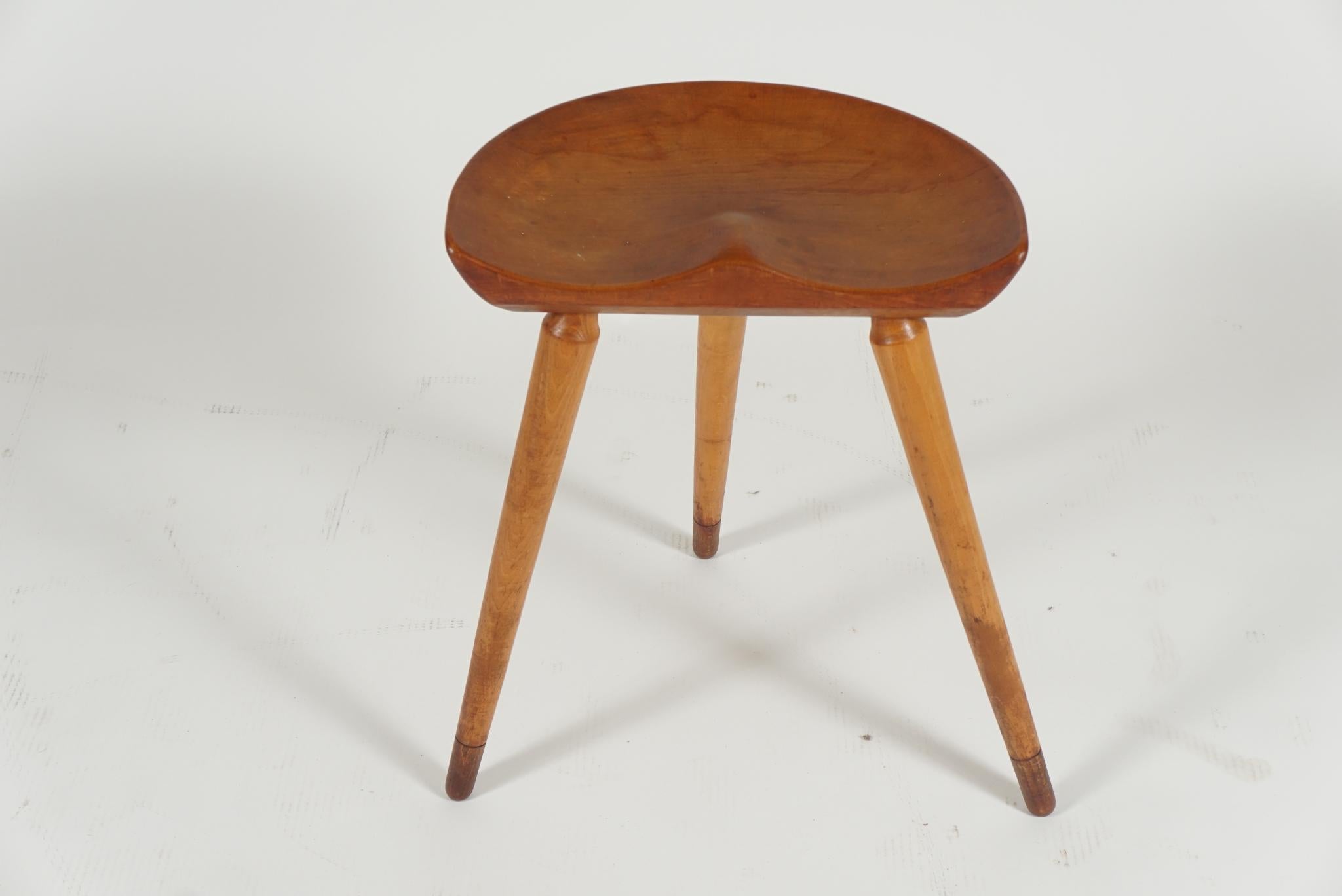 Single Danish modern milking stool in the manner of Mogens Lassen, circa 1950s in beech. Fine patina, nicely aged.