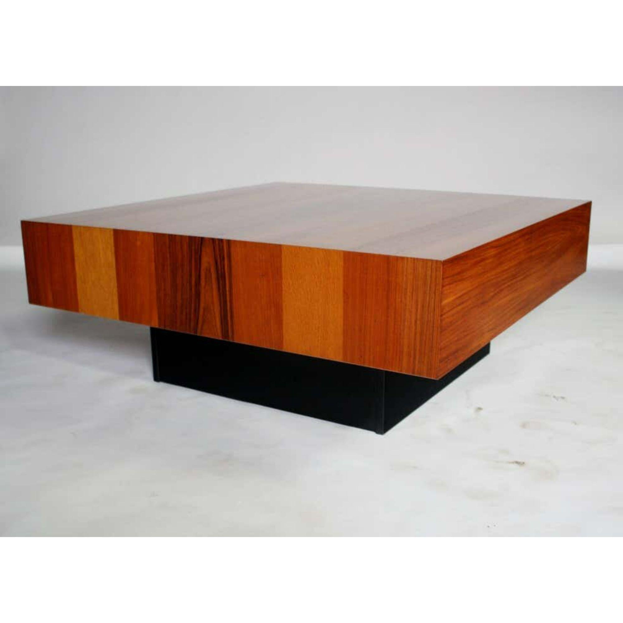 Beautiful square wood coffee table by Drylund of Denmark designed in a parquetry of rosewood, Palisander, teak and maple resting on a black lacquered cube base. In the style of Milo Baughman.

Additional information:
Materials: Lacquer Maple,