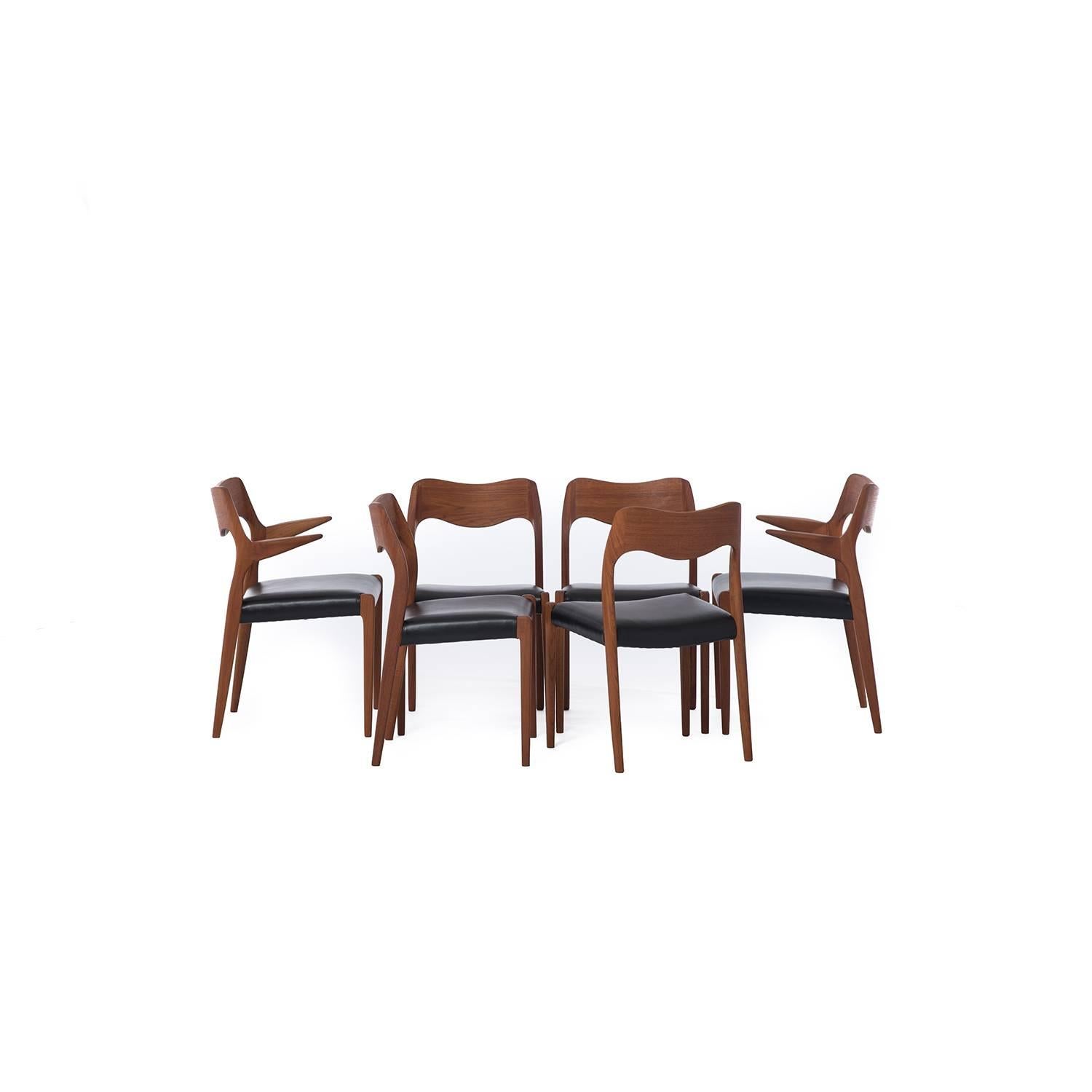 Striking set of Niels Otto Møeller dining chairs in teak. Four side chairs, two captains chairs, sold as a set of six. Newly upholstered in buttery black leather.