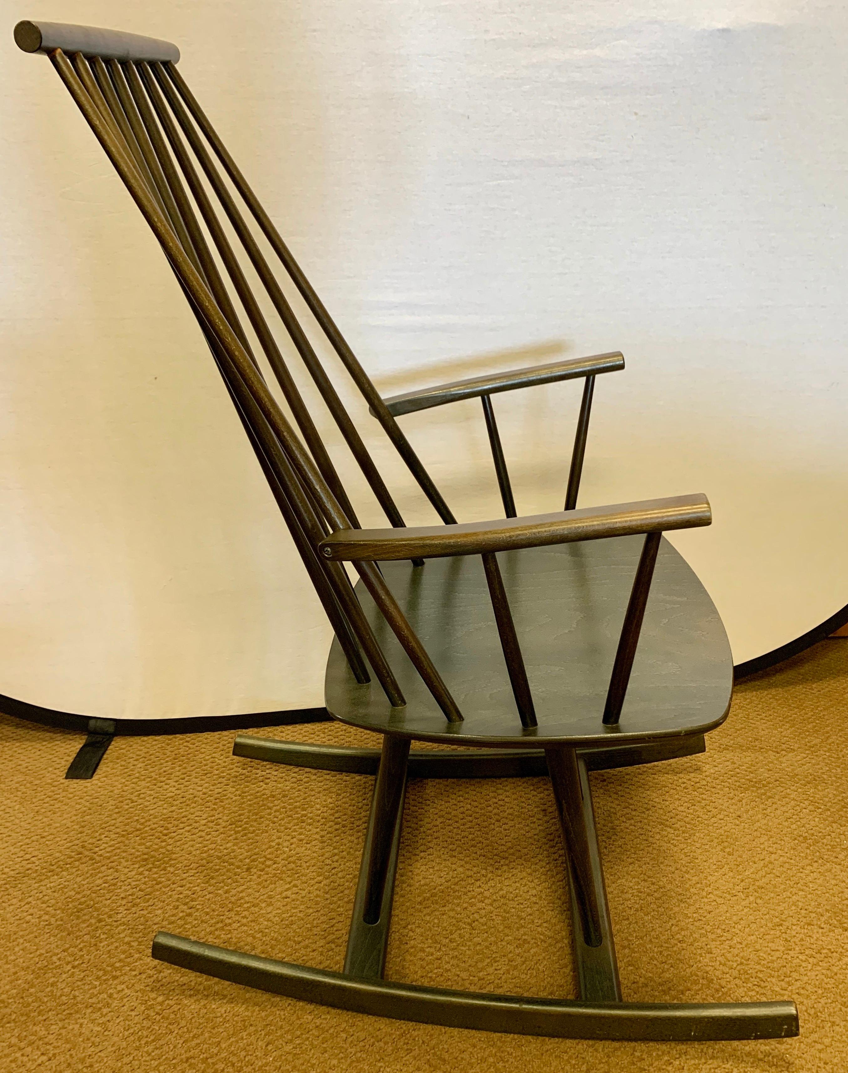 Coveted signed Danish Modern Möbler sculptural rocking chair. Iconic Danish modern classic in a dark mossy green color.. Hallmarks present on bottom, see photos. Sturdy with great lines.