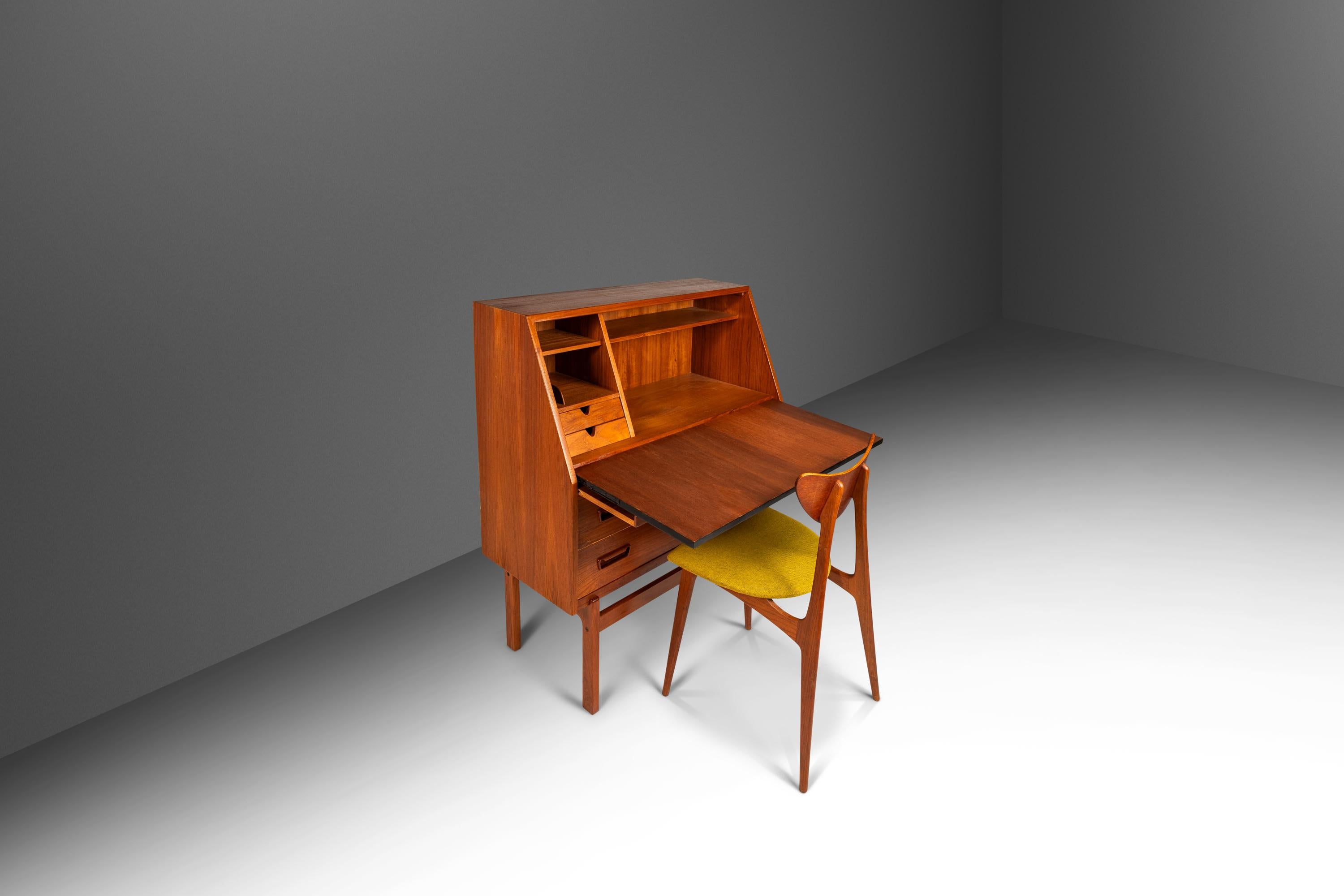 Introducing a freshly restored Model 68 secretary desk designed in the 1960s by the influential Arne Wahl Iversen for Vinde Møbelfabrik. Constructed from a mix of solid and veneered Burmese teak with exceptional old-growth woodgrains this