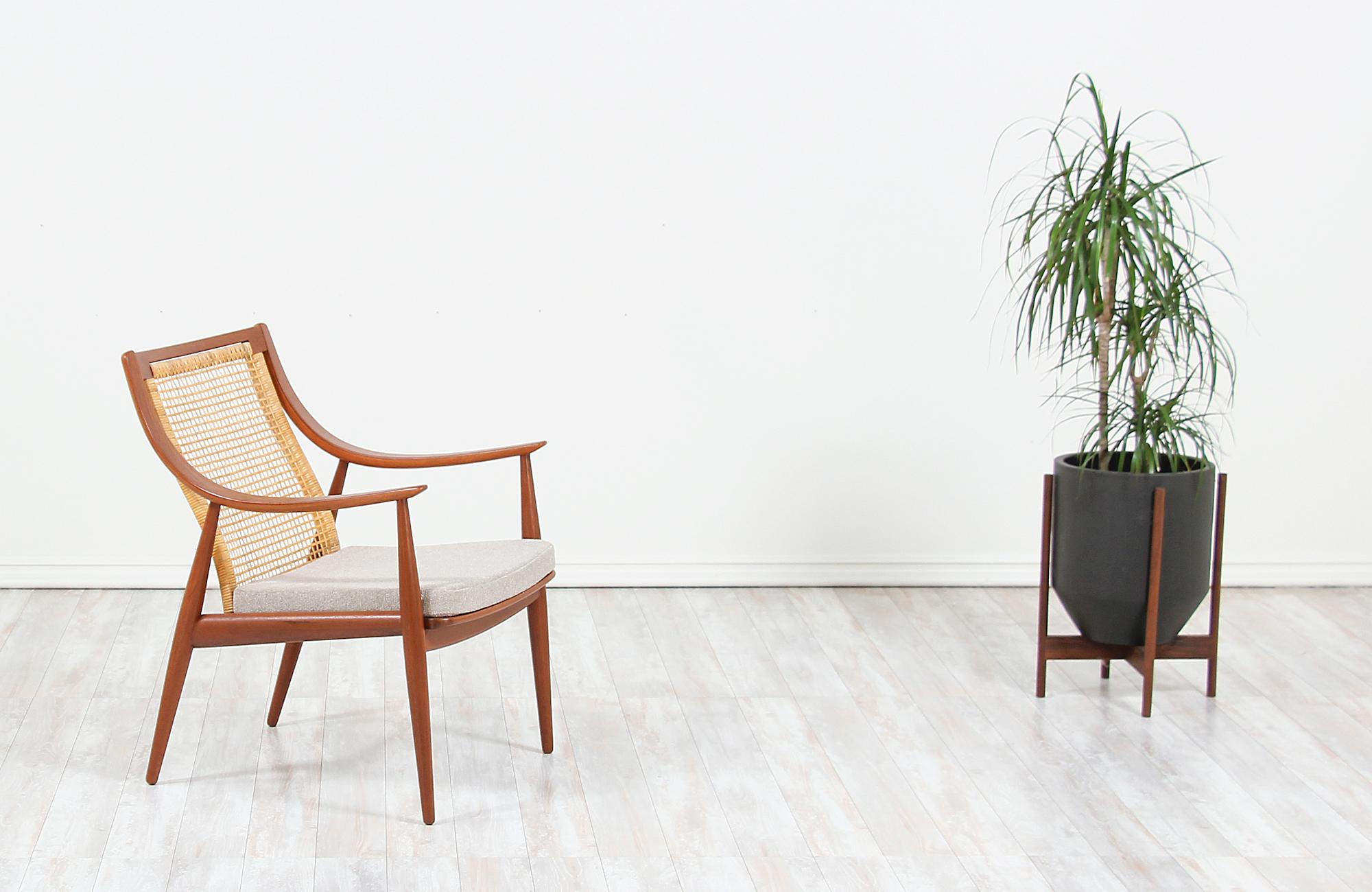 Elegant modern lounge chairs designed by Peter Hvidt & Orla Mølgaard-Nielsen for France & Daverkosen in Denmark, circa 1950s. This spectacular chair model FD-146 features a sturdy teak wood frame with a recently upholstered seat in a quality soft