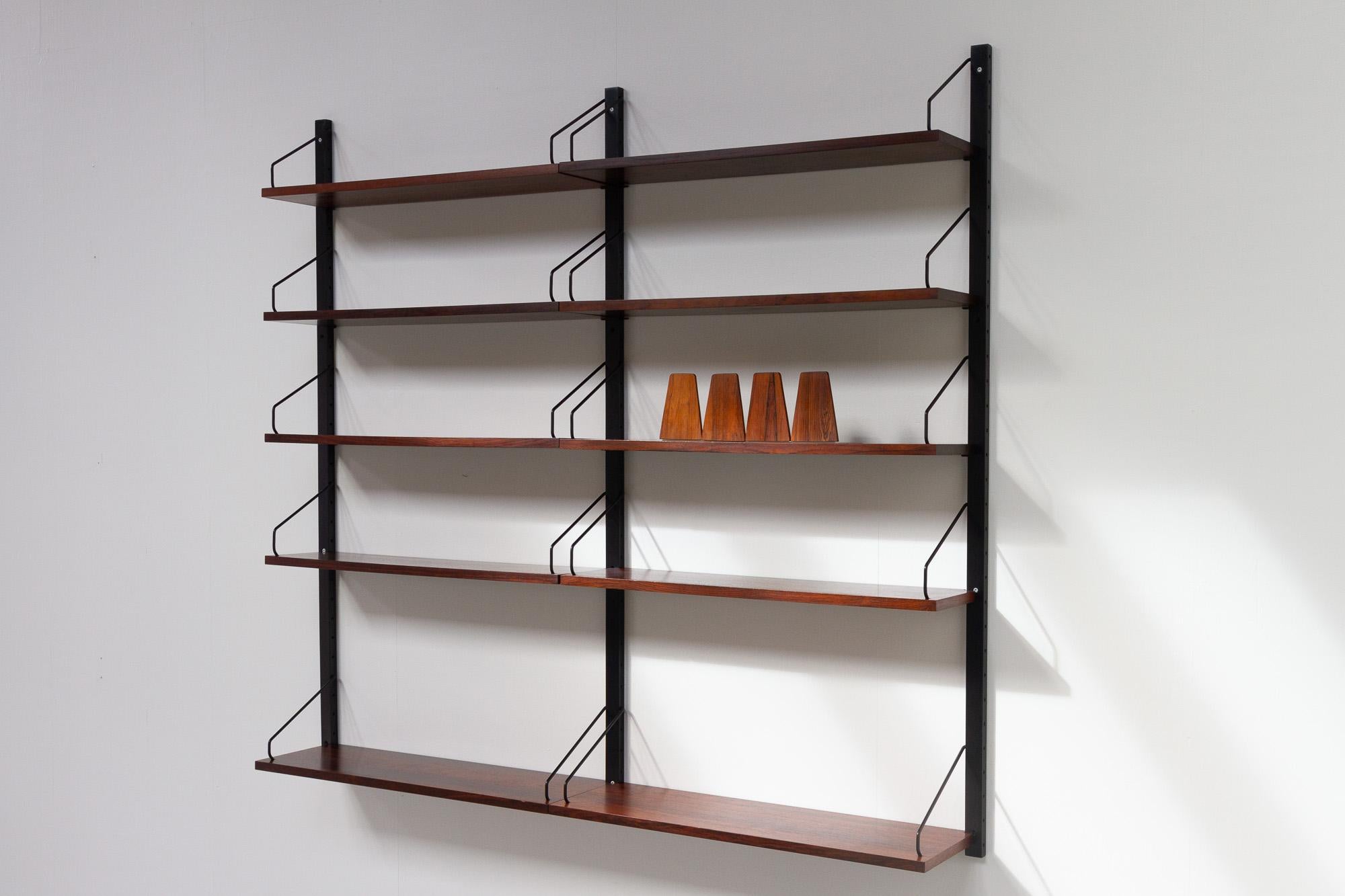 Vintage Danish rosewood wall unit by Poul Cadovius for Cado, 1960s.

Mid-Century Modern 2 bay shelving system model Royal. This is a original vintage floating bookcase designed in 1948 by Danish architect Poul Cadovius. 
Cadovius had the