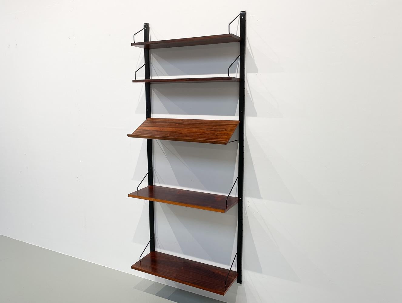 Vintage Danish rosewood wall unit by Poul Cadovius for Cado, 1960s.

Mid-Century Modern 1 bay shelving system model Royal. This is a original vintage floating bookcase designed in 1948 by Danish architect Poul Cadovius. 
Cadovius had the