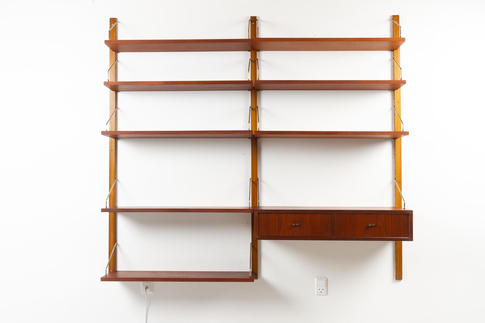 Vintage Danish teak wall unit by Poul Cadovius for Cado, 1950s.

Mid-Century Modern 2 bay shelving system model Royal. This is a original vintage floating bookcase designed in 1948 by Danish architect Poul Cadovius. 
Cadovius had the