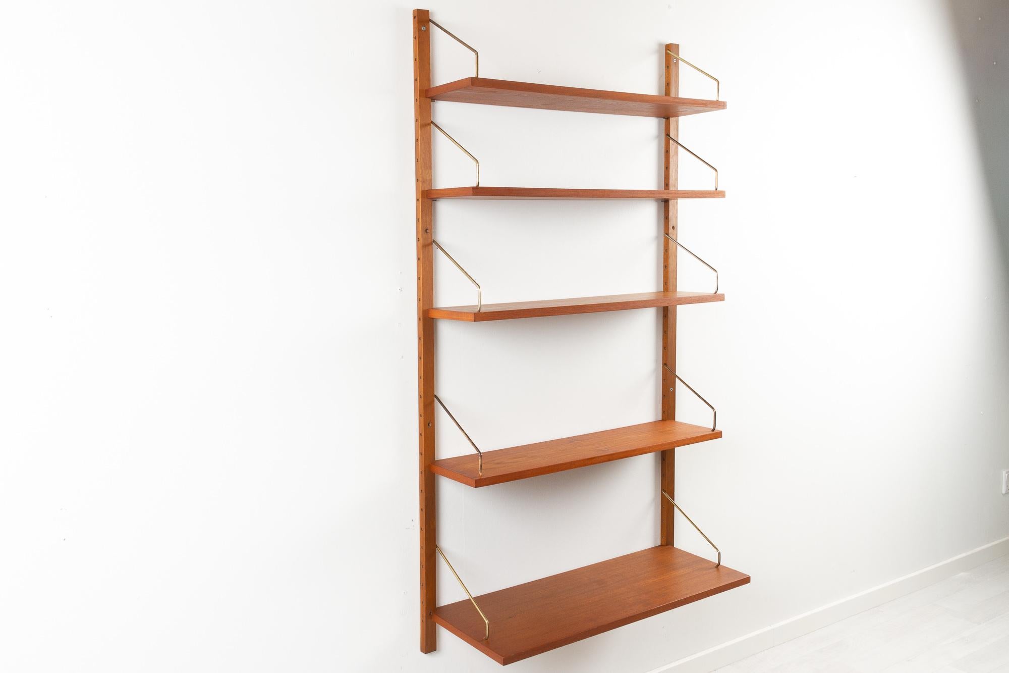Vintage Danish teak wall unit by Poul Cadovius for Cado, 1960s.

Mid-Century Modern 1 bay shelving system model Royal. This is a original vintage floating bookcase designed in 1948 by Danish architect Poul Cadovius. 
Cadovius had the revolutionary