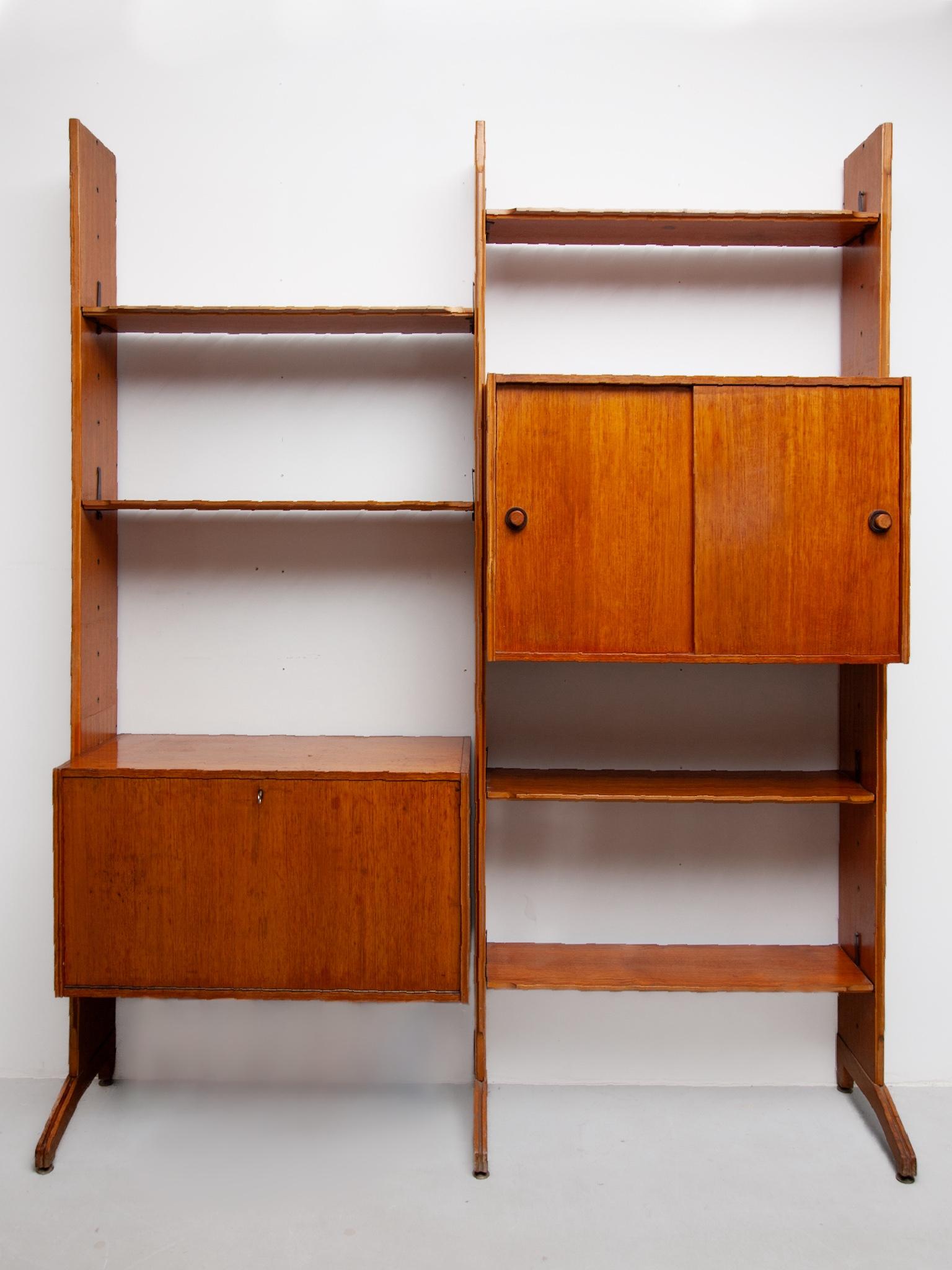 Rare Scandinavian vintage wall-mounted bookcase in original good vintage condition.
Beautiful, high quality modular wall shelf from the 1950s is made of teak with two wall mounted strips. The Danish shelving system, consisting of two modular wall