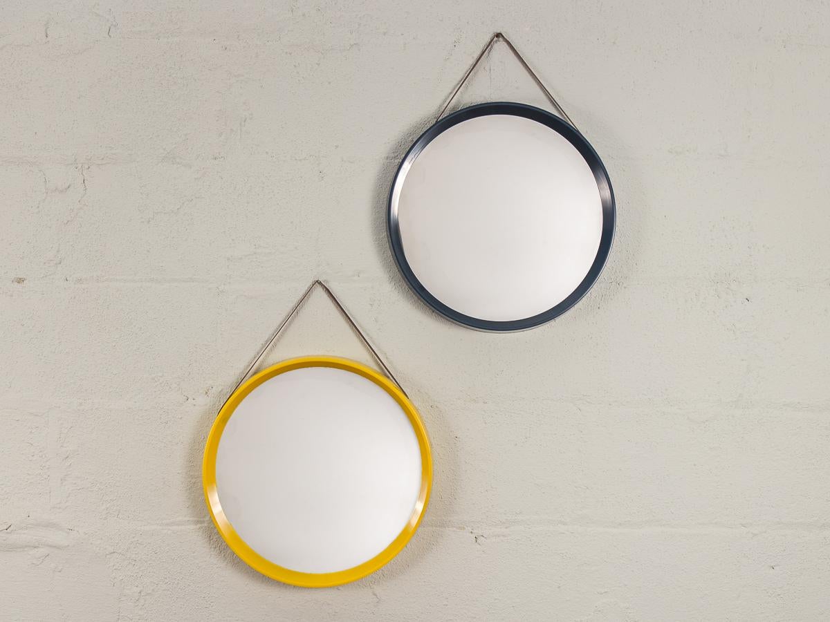 Vintage 1960s Danish modern circular mirror with navy blue frame and leather hanging straps. Mirror is in very good condition, glass is very clean and the frames have no chips or cracks. The delicate leather straps are in good condition with no