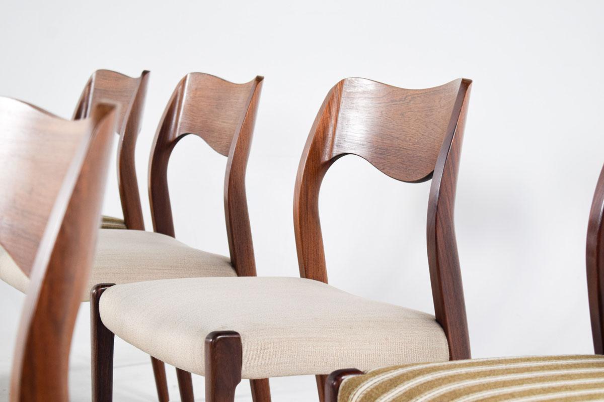 Niels O. Moller design, set of 8 dining chairs, model 71, rosewood, fabric upholstery, manufactured by J.L. Møller Mobelfabrik, Denmark, 1950s. The backs of the chairs are feature the iconic Møller waved back, showing subtle and beautiful lines