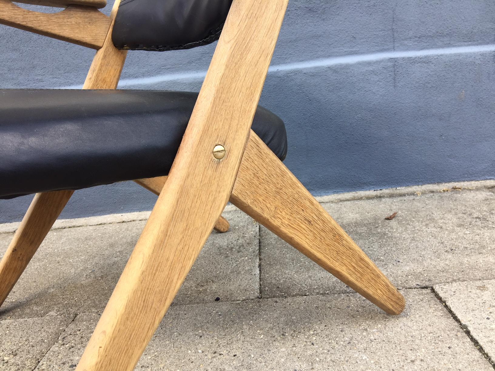 Mid-Century Modern Danish Modern Oak and Black Leather Lounge Chair by Arne Hovmand Olsen, 1960s For Sale