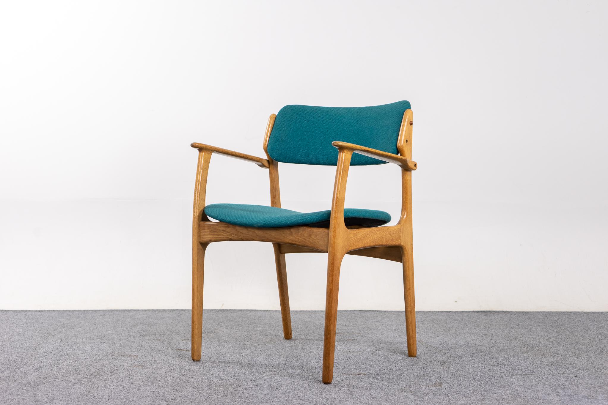 Oak model 50 armchair by Erik Buch, circa 1960's. Sturdy solid oak frame is wonderfully scaled for your many seating needs around the urban home. Elegant frame with floating bottom design. Danish Furniture Makers' control stamp intact.

Unrestored