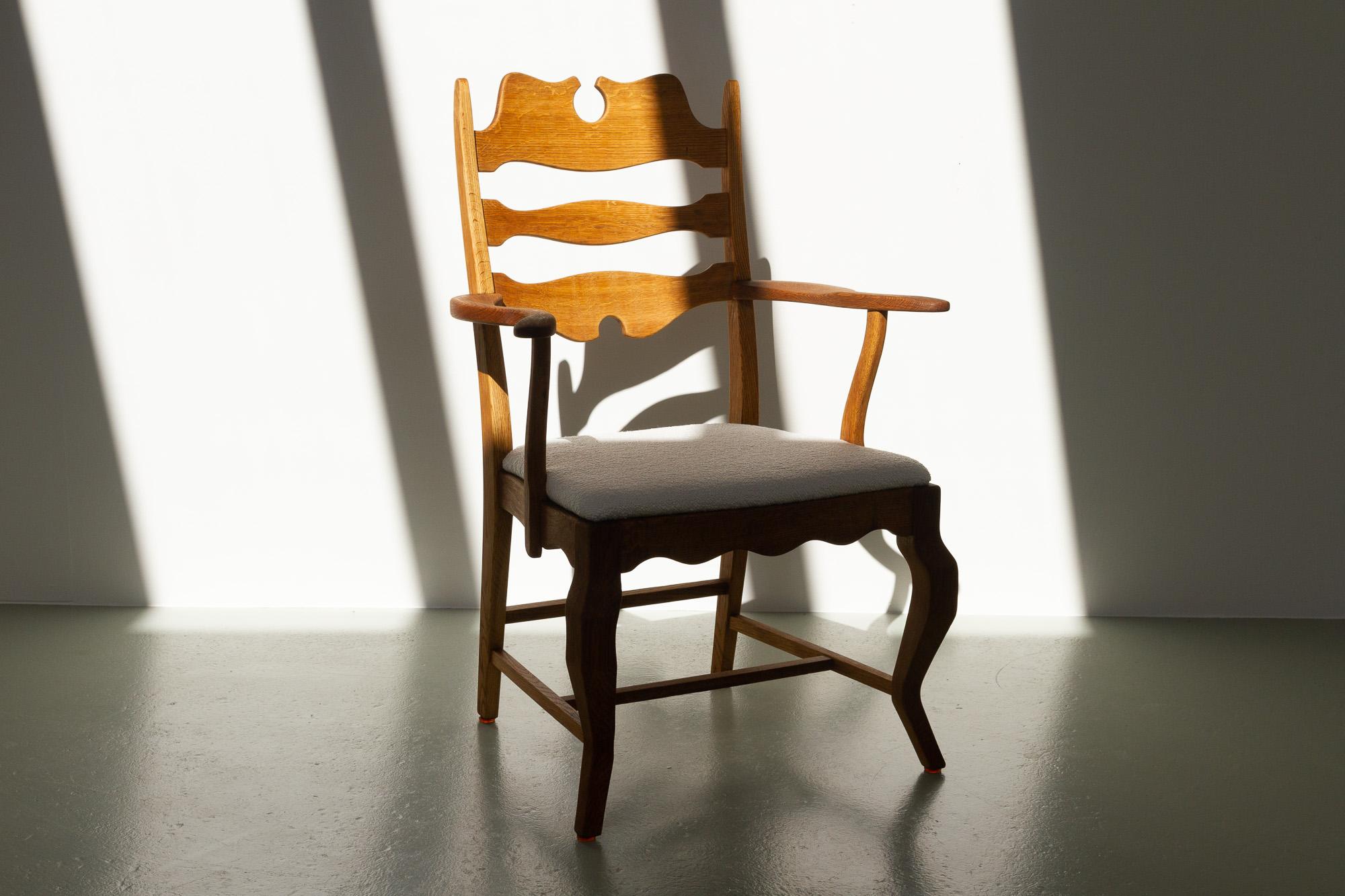 Danish Modern Oak Razor blade Armchair by Henning Kjærnulf for EG Møbler, 1960s.
Vintage Danish armchair in solid patinated Scandinavian oak and seat re-upholstered in off-white Bouclé.
A Danish Mid-Century Modern take on the Classic Baroque