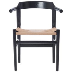 Silla auxiliar moderna danesa con brazos truncados