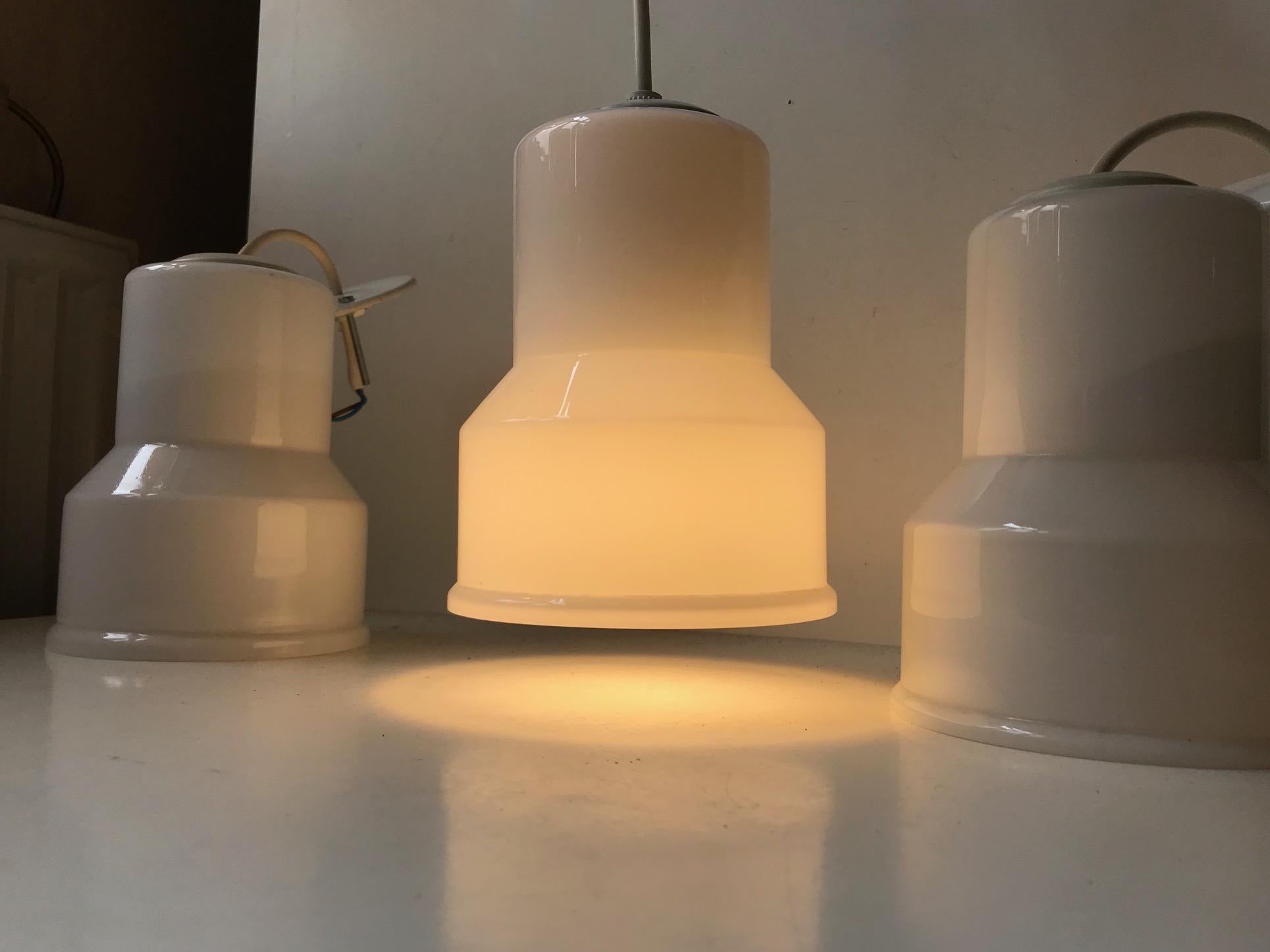 - A set of 3 white opaline glass pendant lamps
- Manufactured and designed by Lyskær (previously NES) in Denmark
- Dates from the early 1970s
- Comes with 3 x 3 meters of new white cord.
