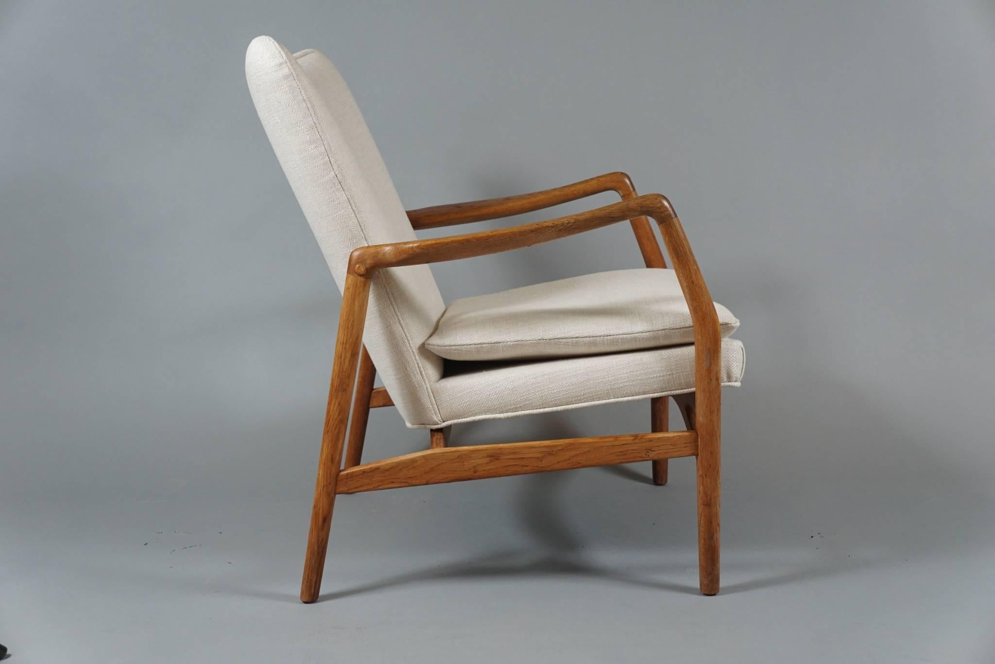 Oak frame open armchair by Danish designer Kurt Olsen, circa 1950s. Newly upholstered in a linen fabric.