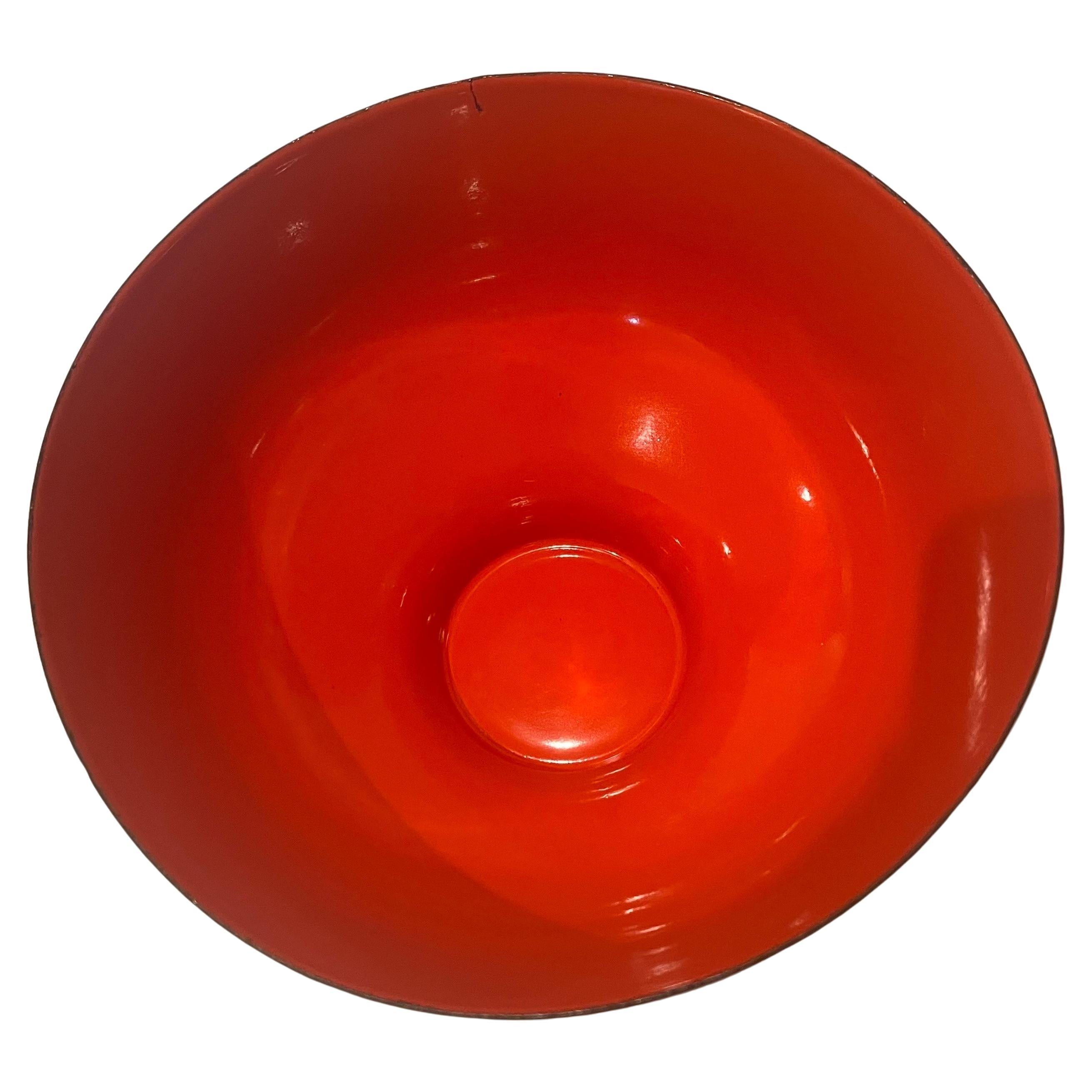 Danish modern orange/brown enamel Krenit bowl by Herbert Krenchel for Torben Orskov, circa the 1950s. Beautiful color nice condition very rare shape has a tiny original flaw on the edge .
