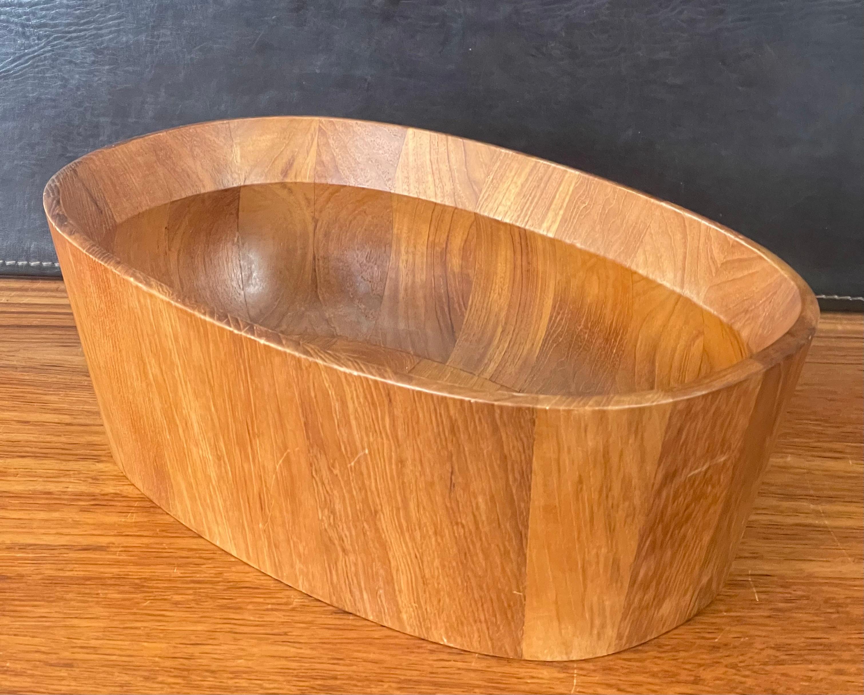 A very nice Danish modern oval shaped staved teak bowl by Jens Quistgaard for Dansk, circa 1960s. The bowl is in very good vintage condition and measures 14