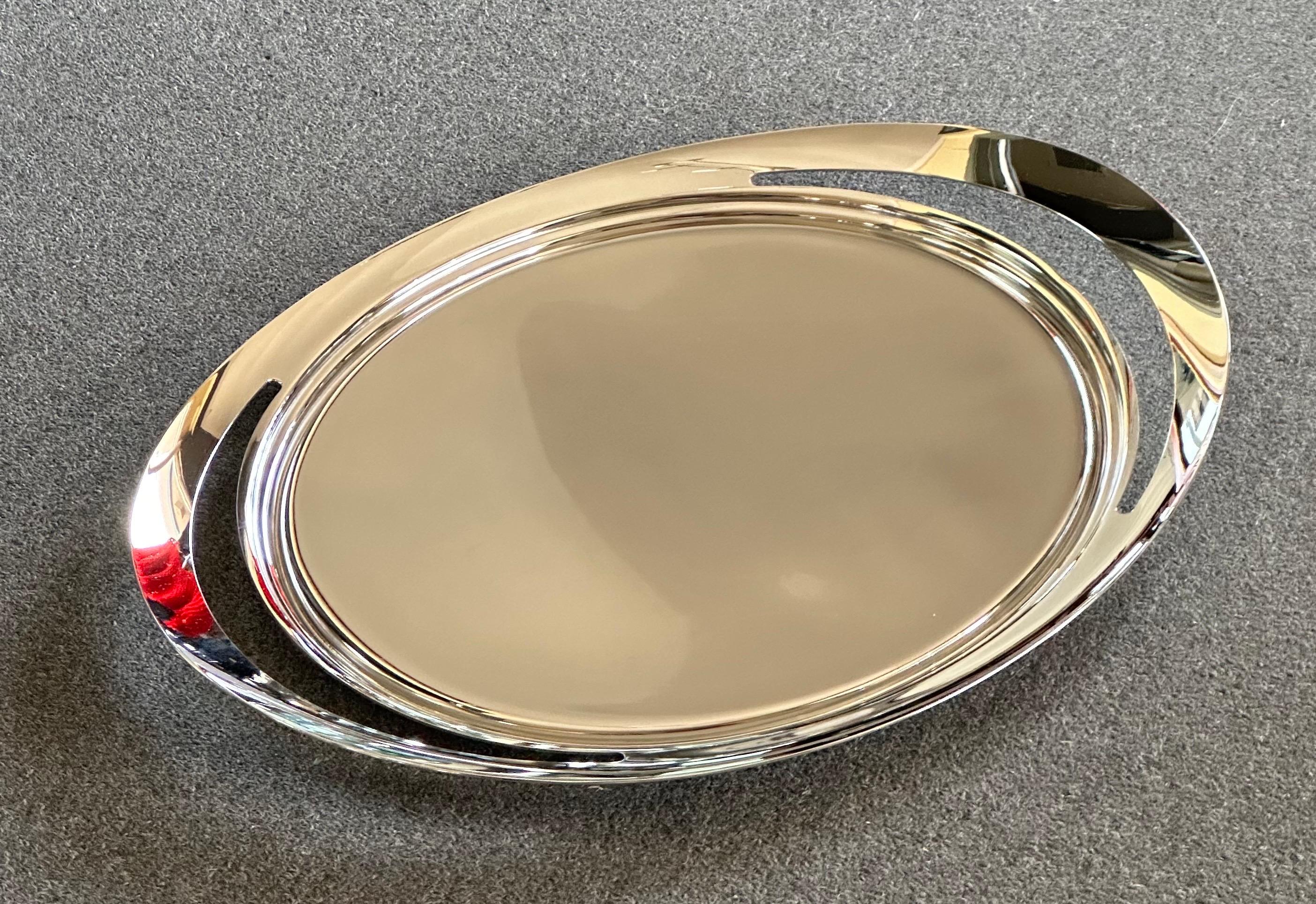 Beautiful Danish modern stainless steel oval serving tray by Constantin Wortmann for Georg Jensen, circa 2000s. The tray is in excellent brand new condition in original box; it measures 19