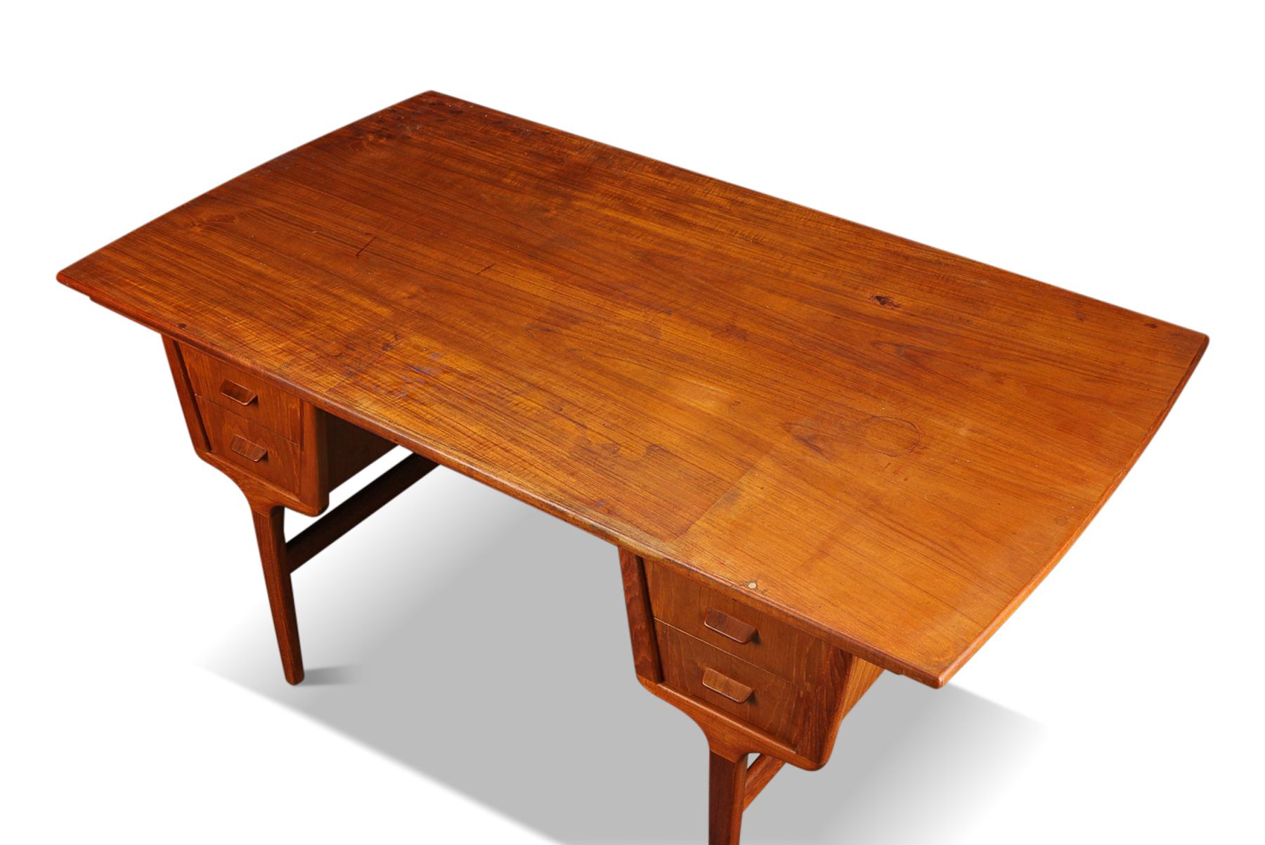 Origin: Denmark
Designer: Unknown
Manufacturer: Unknown
Era: 1950s
Materials: Teak
Measurements: 59? wide x 33? deep (leaves in), 63? deep (leaves out) x 29.5? tall

Condition: In good original condition with some cosmetic wear (will be