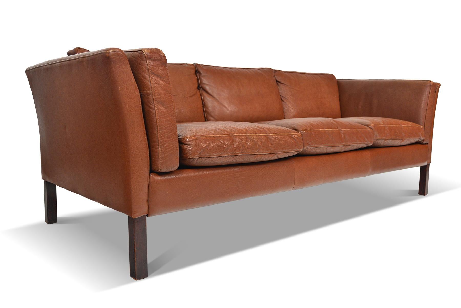 Scandinavian Modern Danish Modern Patinated Rust Toned Leather Three-Seat Leather Sofa