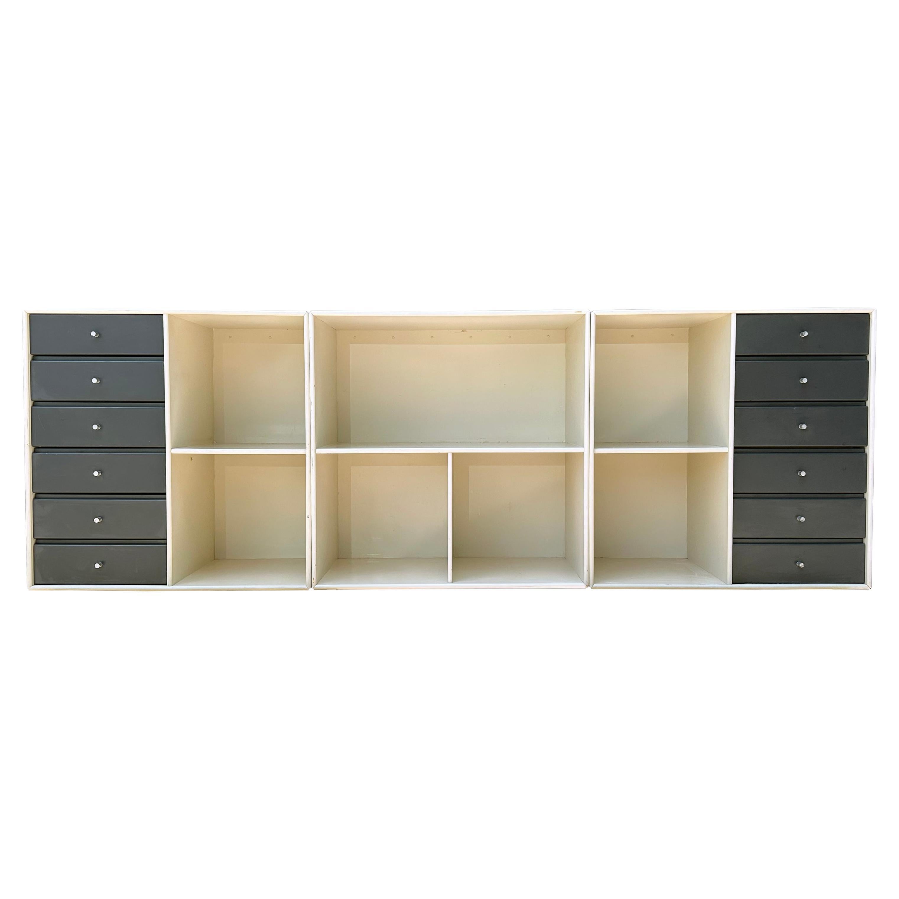 Danish modern 3 piece modular suspension credenza unit by Peter J. Lassen for Montana Mobler. This piece can by hung on the wall or stacked or placed on the floor. Set includes 2 opposing 6 drawer shelving units and 1 open shelf unit. Shelf openings