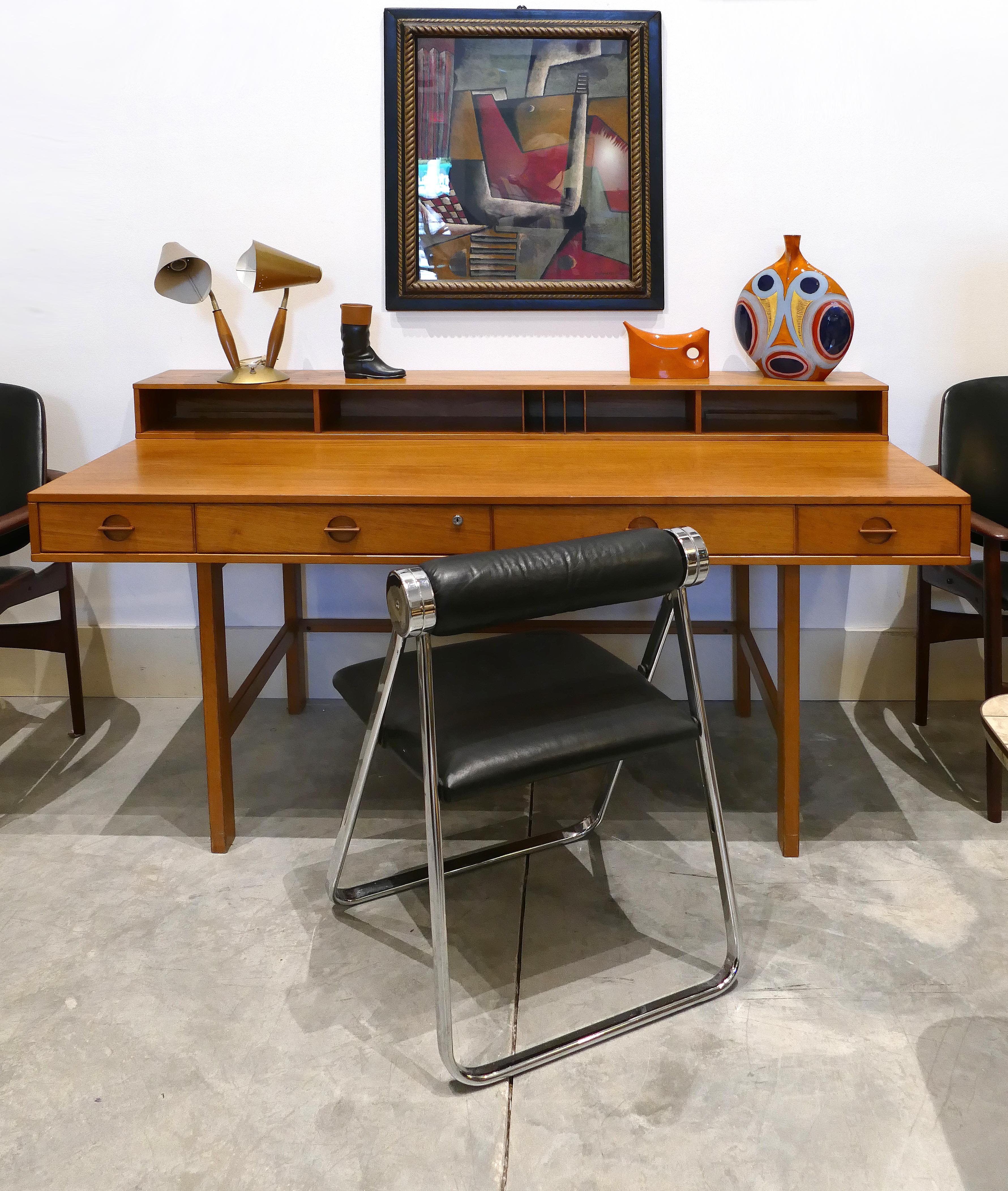 Danish modern Peter Løvig Nielsen flip topdesk designed by Jens Quistgaard

Offered for sale is a 1960s Danish modern Peter Løvig Nielsen flip topwriting architect's desk. The desk offers a very practical hinged gallery to top that flips down to