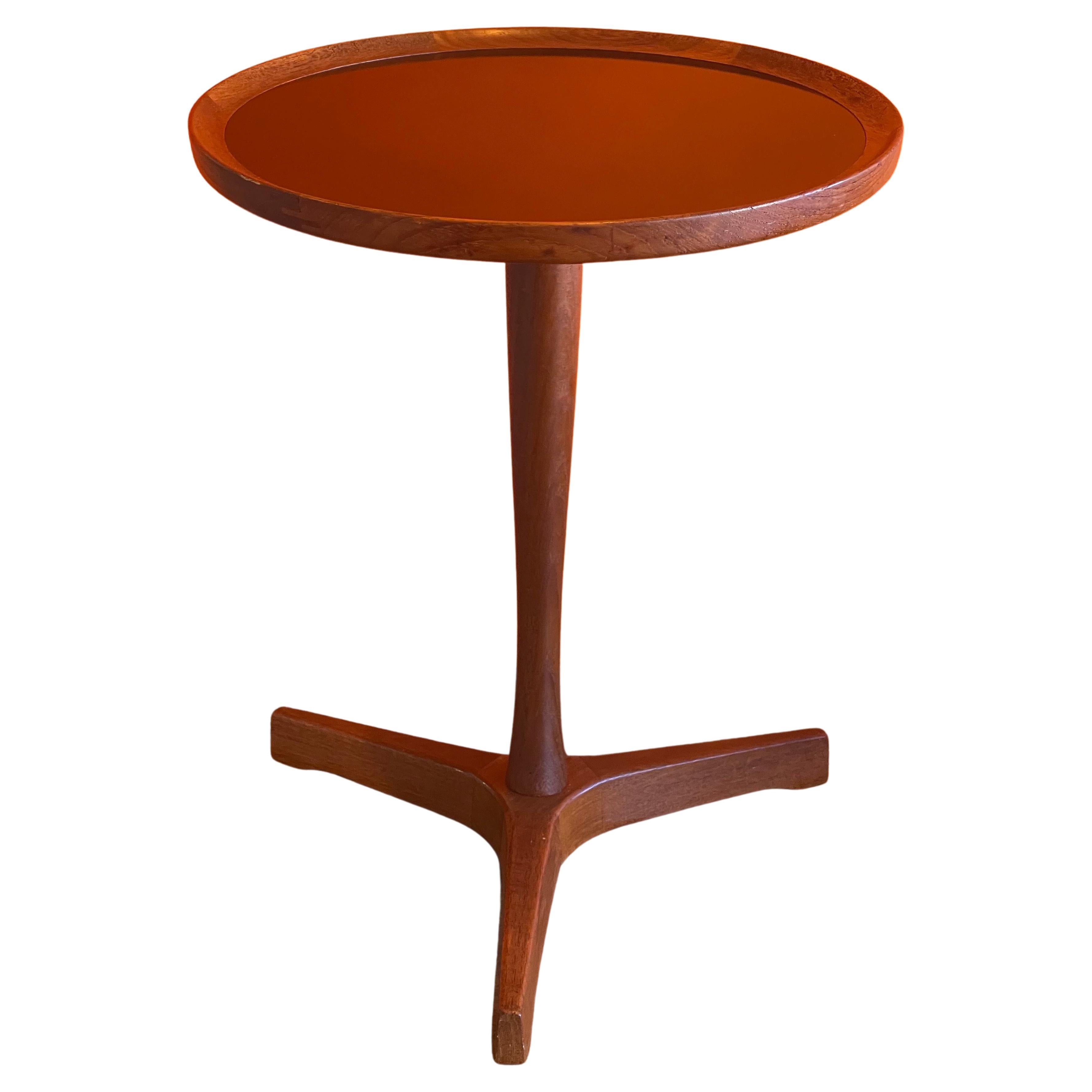 Rare petite teak occasional table with black melamine top by Hans C. Andersen, circa 1950s. This small table has beautiful wood joints on the table top along with excellent detailing and craftsmanship. The table is in very good vintage condition