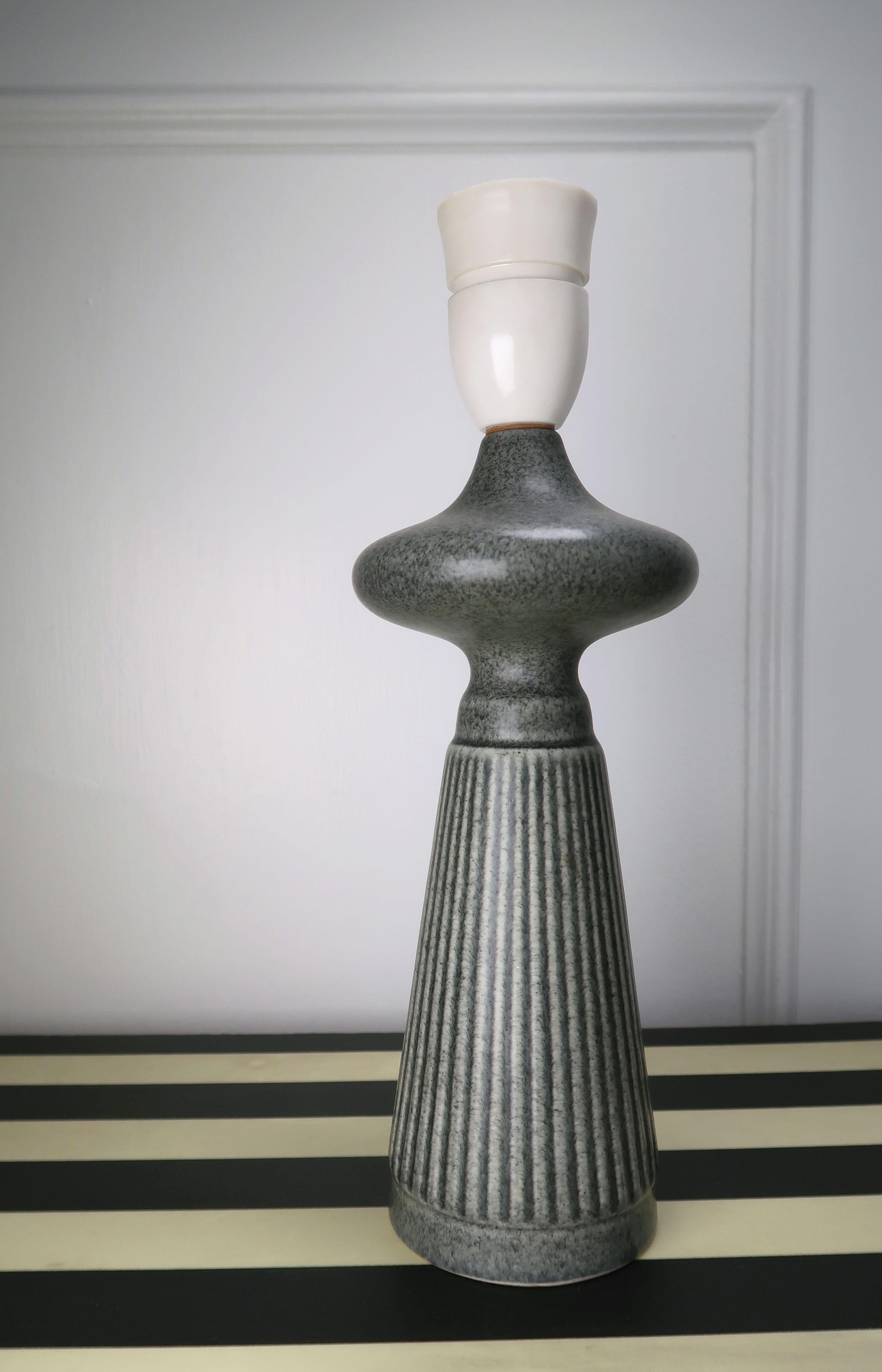 Sculptural lady shaped pewter green glazed smooth stoneware table lamp by Danish Søholm Stentøj. Attributed to Einar Johansen. Smooth top and vertical relief striped pattern on body. Model 958. Stamped under base. In beautiful vintage