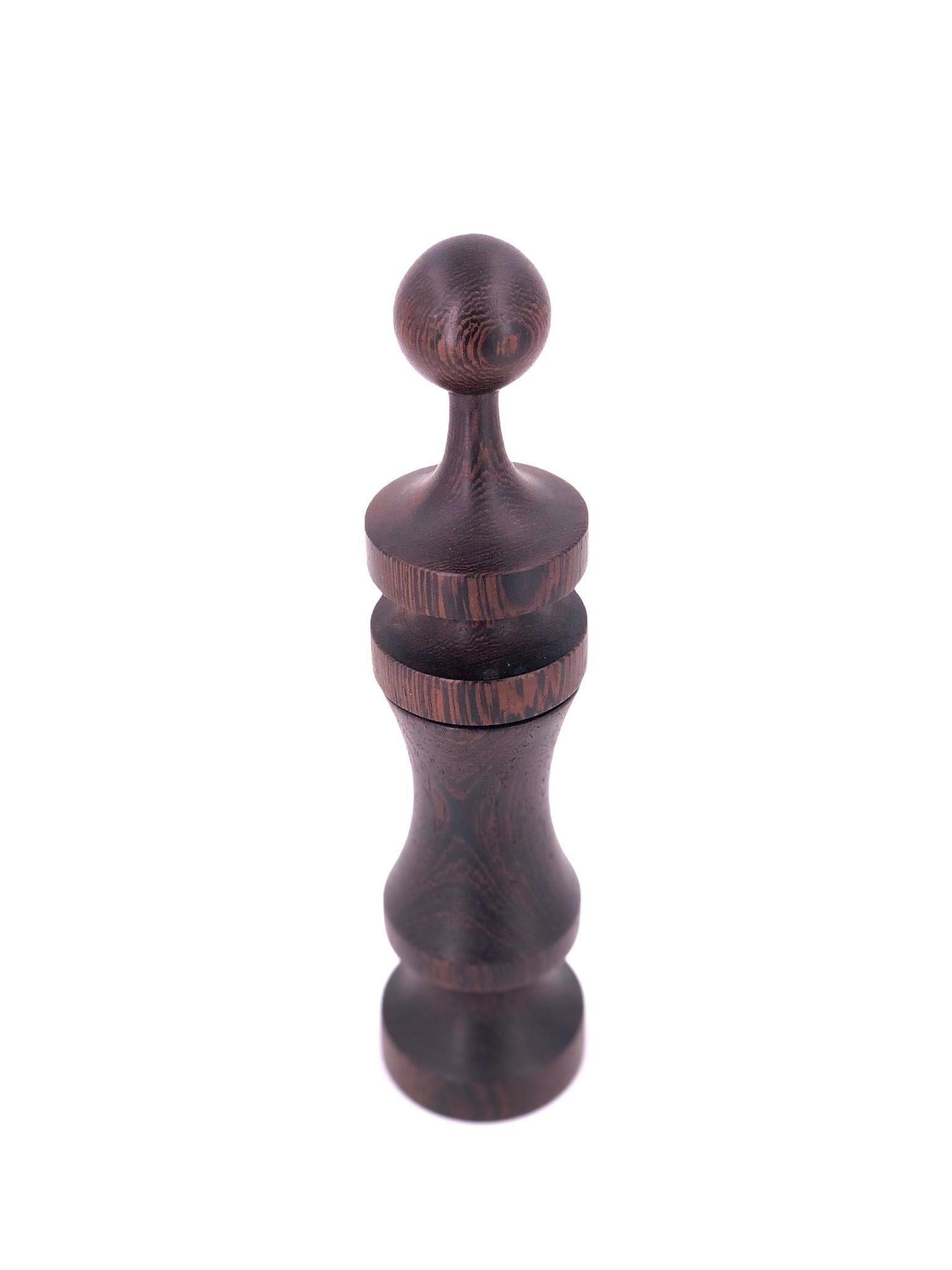 Beautiful shape with metal movement solid Wenge wood rare pepper grinder, by Laurids Longborg, circa 1960s made in Denmark great condition the top pulls up to place the peppercorns.