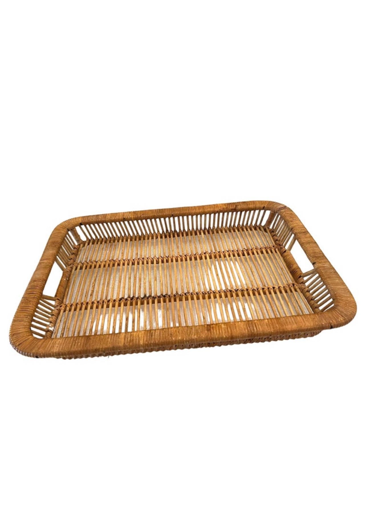 Danish Modern Rattan tray was designed and made by Artek in Finland during the 1960s. Hand woven from cane and rattan. Good vintage condition with signs of age-related wear and patina.

these beautifully crafted trays were designed, produced, and