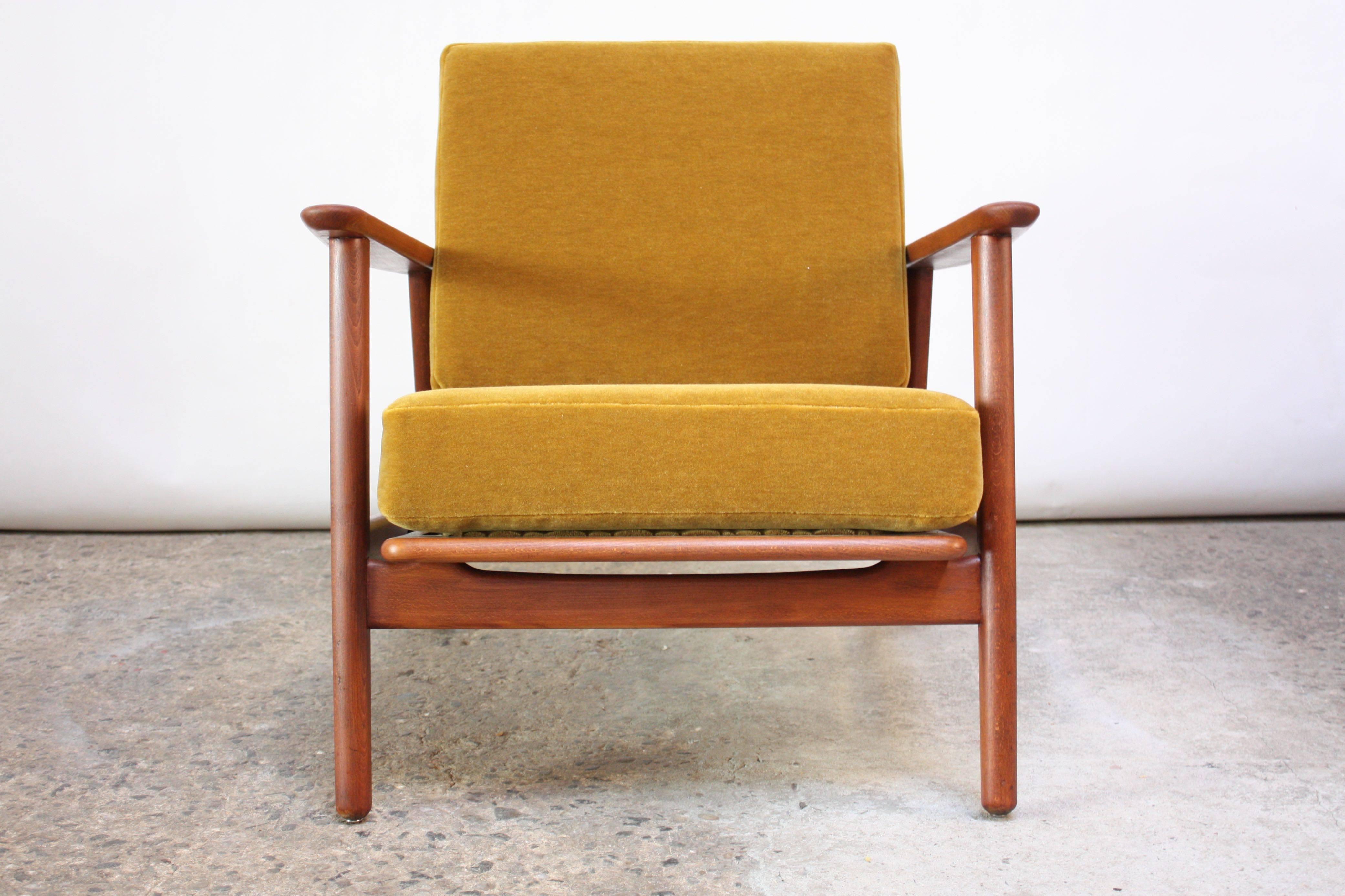 1960s Danish lounge chair with wide, sculptural arms and ochre mohair cushions. Features slight reclining function (the seat only leans back an additional 2